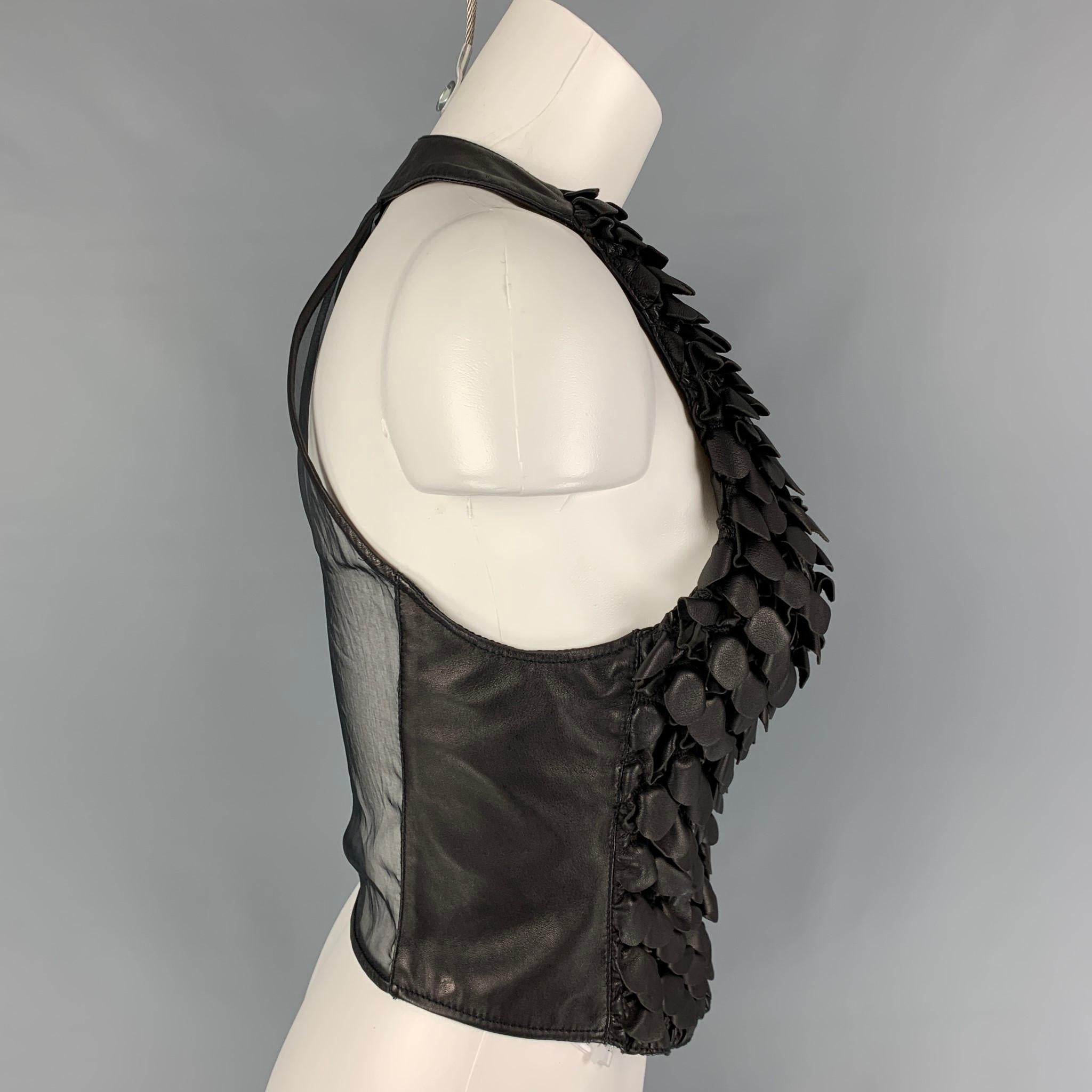 GIORGIO ARMANI dress top comes in a black leather featuring a halter style, see through back, and a buttoned closure. Made in Italy. 

New With Tags. 
Marked: 40
Original Retail Price: $2,425.00

Measurements:

Bust: 28 in.
Length: 16 in. 