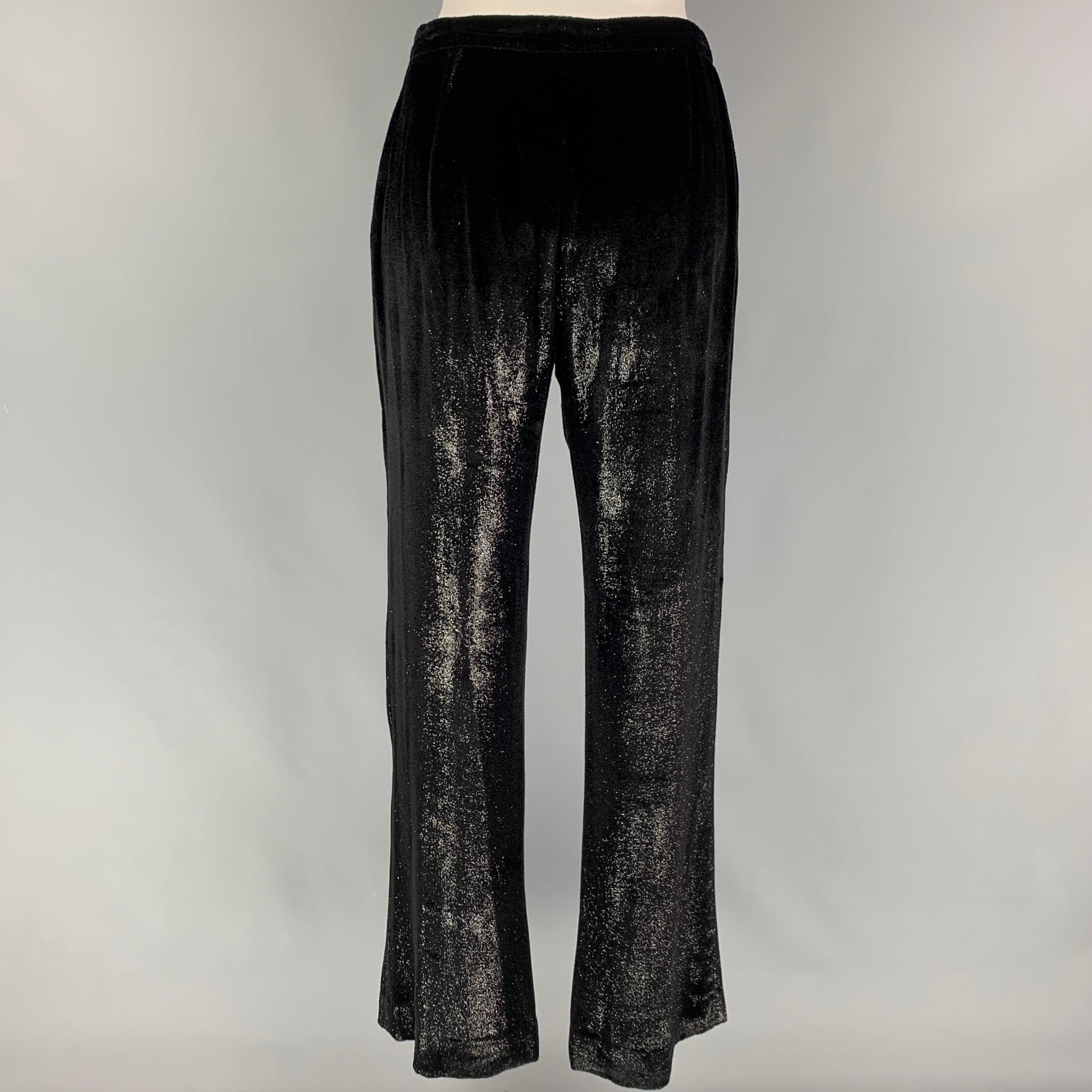 GIORGIO ARMANI pants come in a black velvet sparkly viscose blend featuring a wide lep and a side zip up closure. Made in Italy. 

Very Good Pre-Owned Condition.
Marked: 40

Measurements:

Waist: 27 in.
Rise: 9 in.
Inseam: 32 in. 