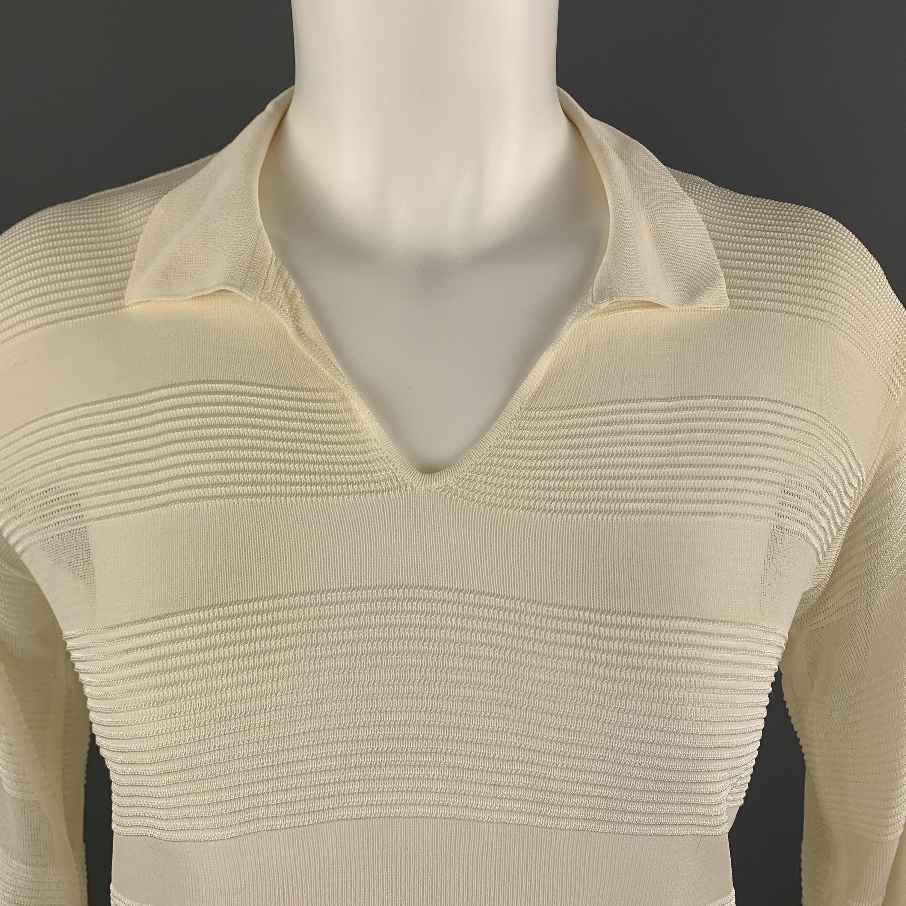 GIORGIO ARMANI pullover comes in cream burnout ribbed stripe sheer knit with a collared V neck. Made in Italy.

Excellent Pre-Owned Condition.
Marked: IT 40

Measurements:

Shoulder: 17 in.
Bust: 38 in.
Sleeve: 23 in.
Length: 23 in.