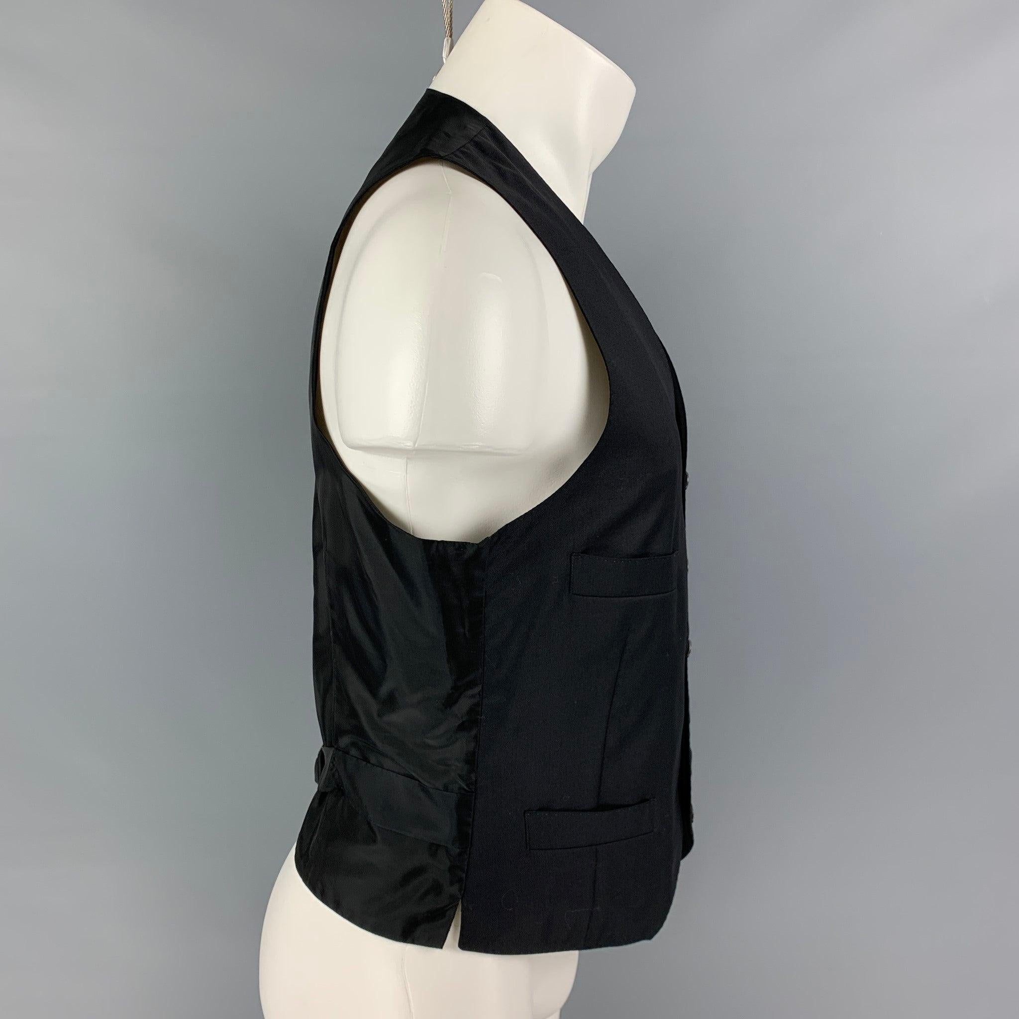 GIORGIO ARMANI vest comes in a black wool / cashmere featuring a adjustable back strap, slit pockets, and a buttoned closure. Made in Italy.
Excellent
Pre-Owned Condition. 

Marked:   50 

Measurements: 
 
Shoulder: 13 inches Chest: 38 inches