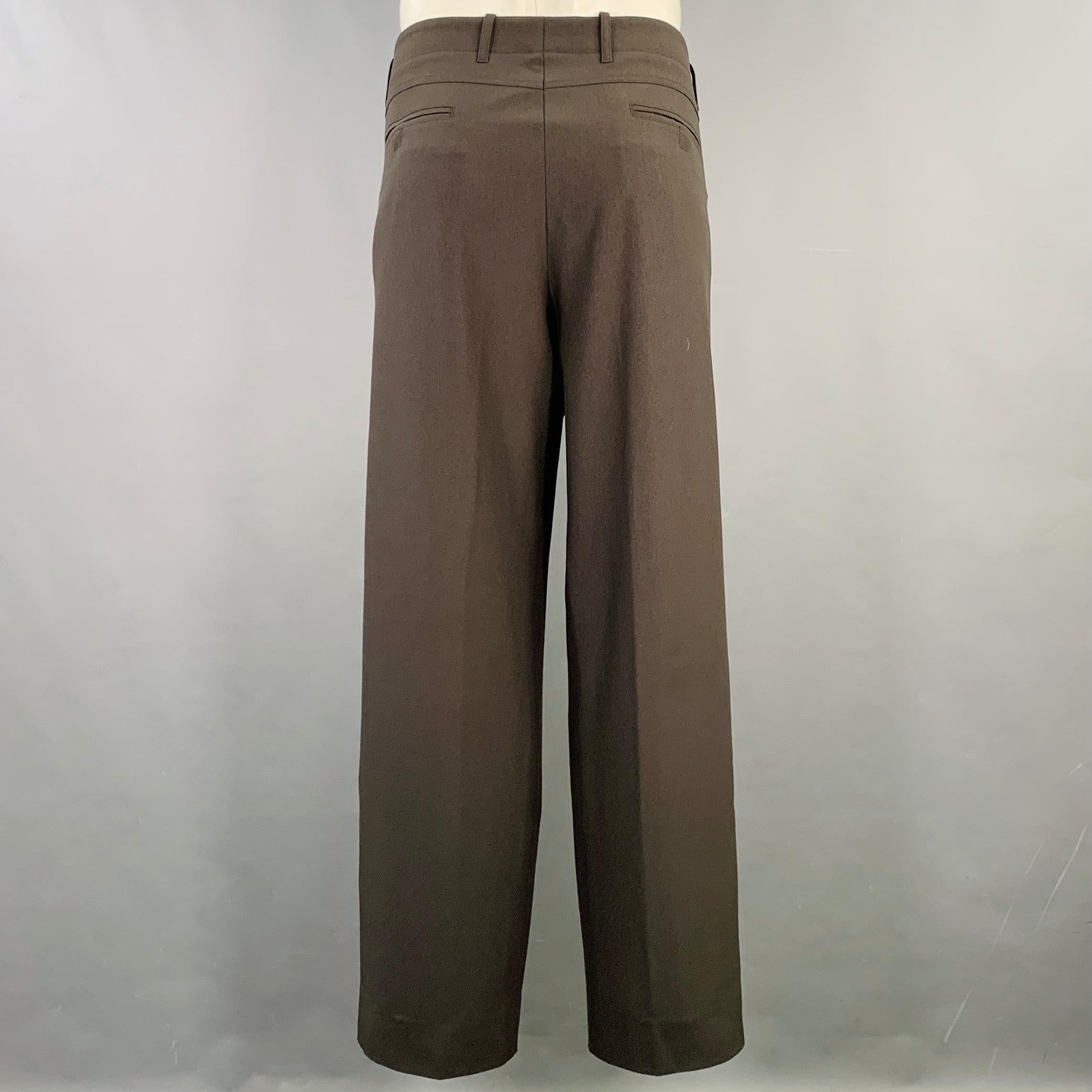 GIORGIO ARMANI dress pants
in a charcoal grey polyester featuring a flat front style, Excellent Pre-Owned Condition. 

Marked:   IT 58, fits 40 inches  

Measurements: 
  Waist: 40 inches Rise: 10 inches Inseam: 32 inches 
  
  
 
Sui Generis