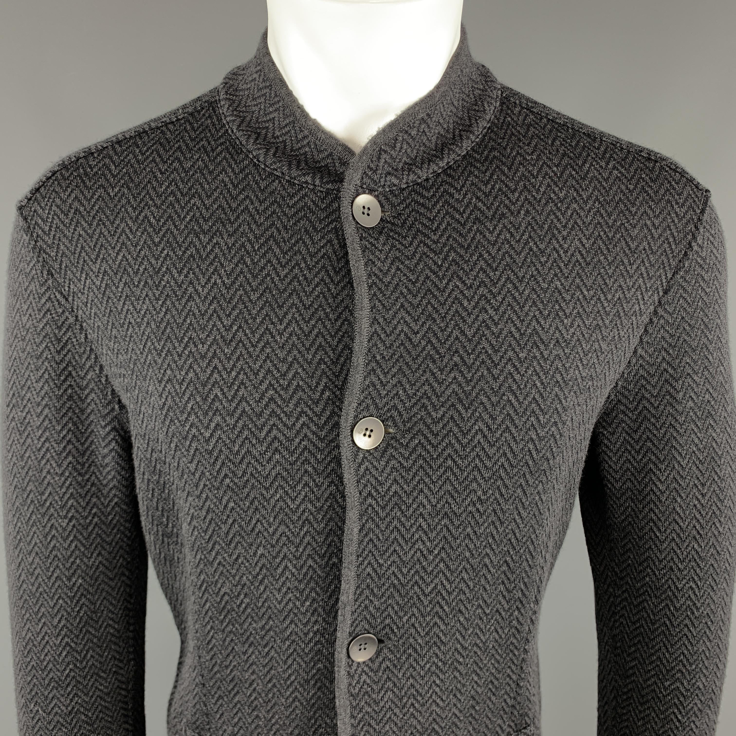 GIORGIO ARMANI Jacket comes in charcoal and black tones in a zig zag wool blend material, with a nehru collar, four buttons at closure, slit pockets, unbuttoned cuffs, unlined. Made in Italy.

Excellent Pre-Owned Condition.
Marked: IT