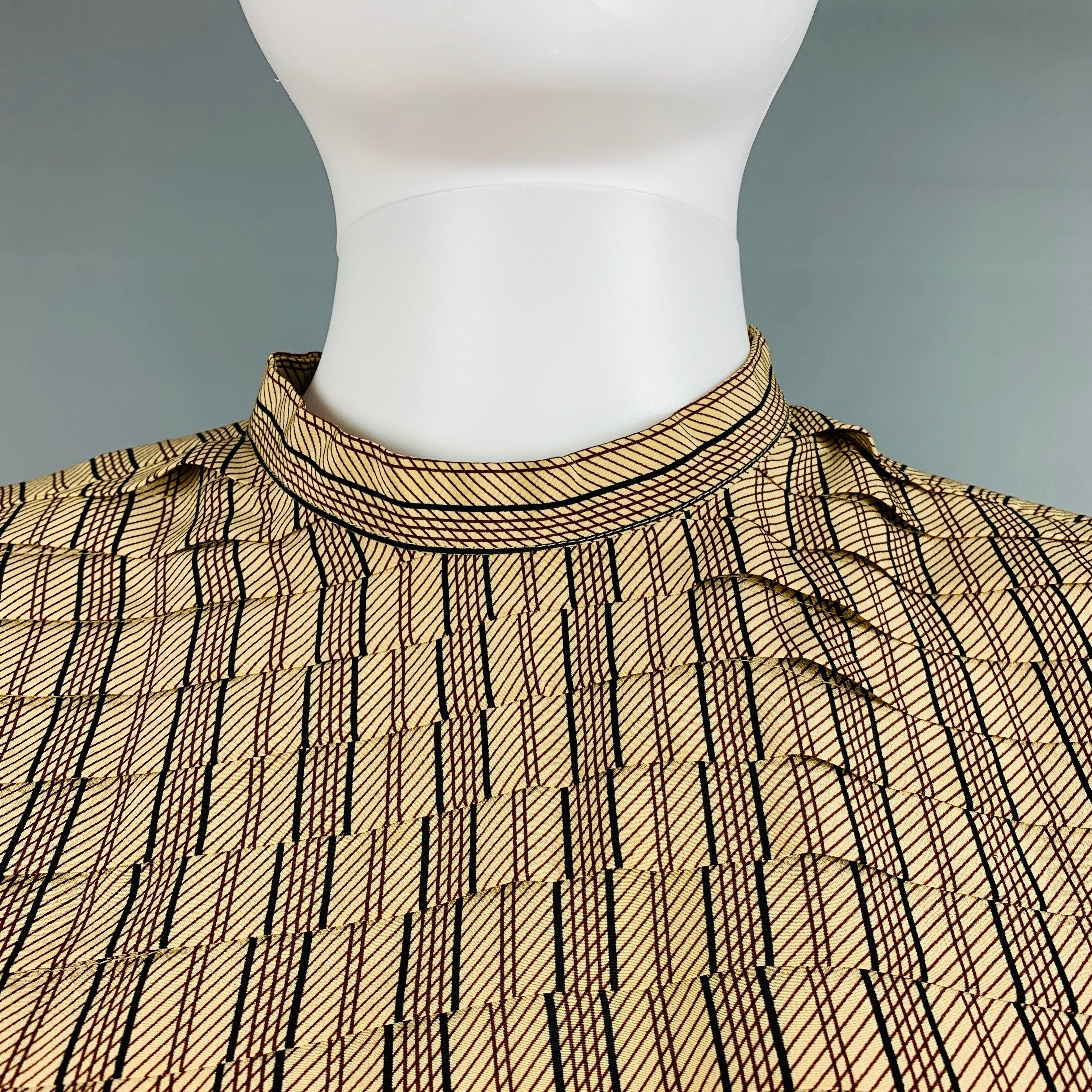 GIORGIO ARMANI long sleeves blouse comes in beige and burgundy striped silk woven features a pleated texture at front, shoulder pads, and a button up closure at back.
Very Good Pre- Owned Condition.  

Marked:   6 

Measurements: 
 
Shoulder: 16