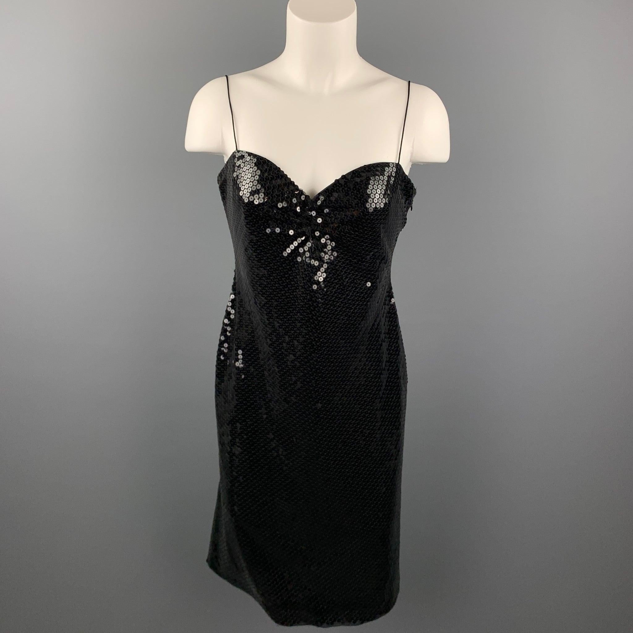 GIORGIO ARMANI cocktail dress comes in a black sequined polyester blend featuring spaghetti straps, matching shawl, and a side zipper closure. Made in Italy.Very Good
 Pre-Owned Condition. 
 

 Marked:  IT 42 
 

 Measurements: 
  Bust: 32 inches 
