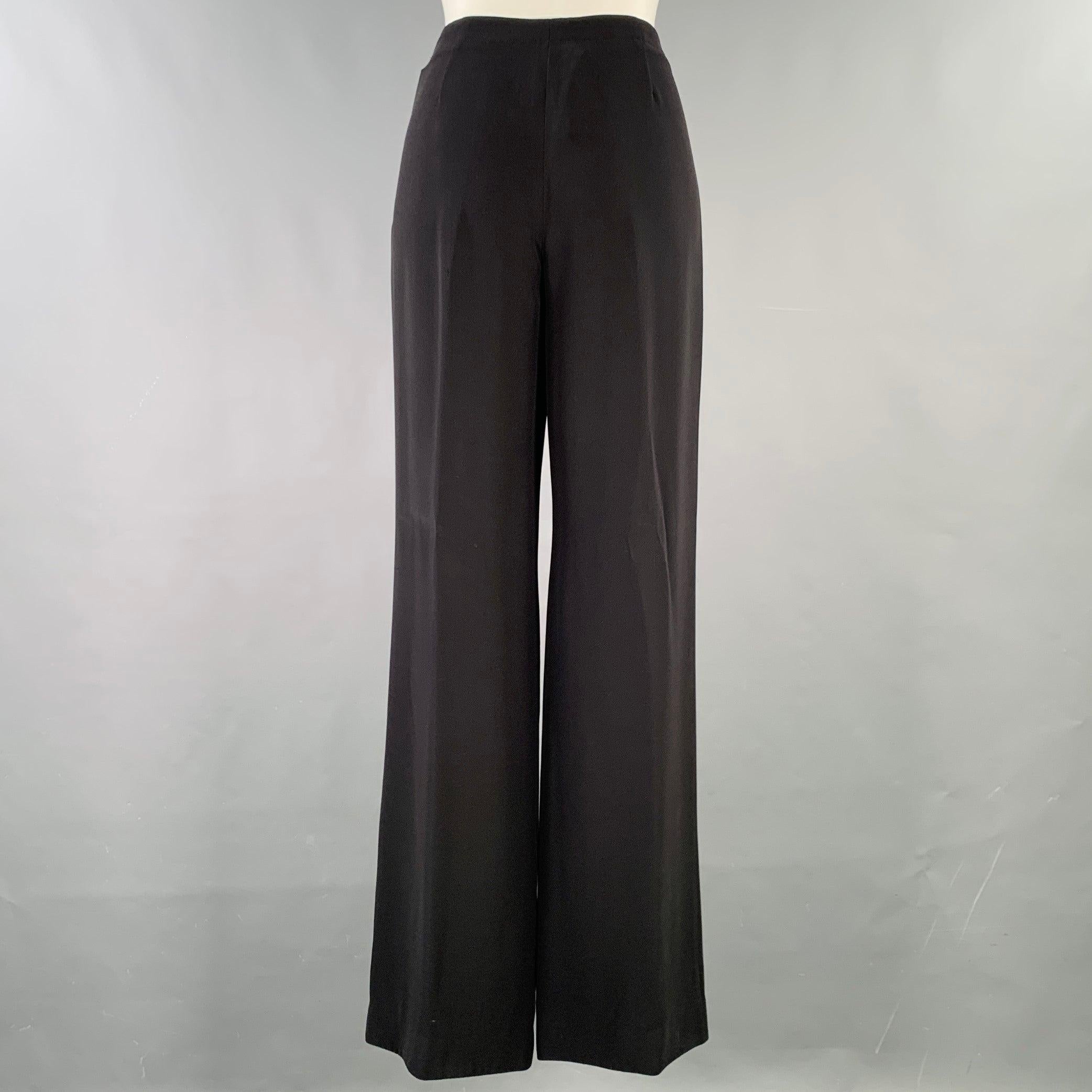 GIORGIO ARMANI dress pants
in a black silk woven fabric featuring a flat front, wide leg, and side zipper closure. Made in Italy.Very Good Pre-Owned Condition. Minor signs of wear. 

Marked:   IT 42 

Measurements: 
  Waist: 29 inches Rise: 10