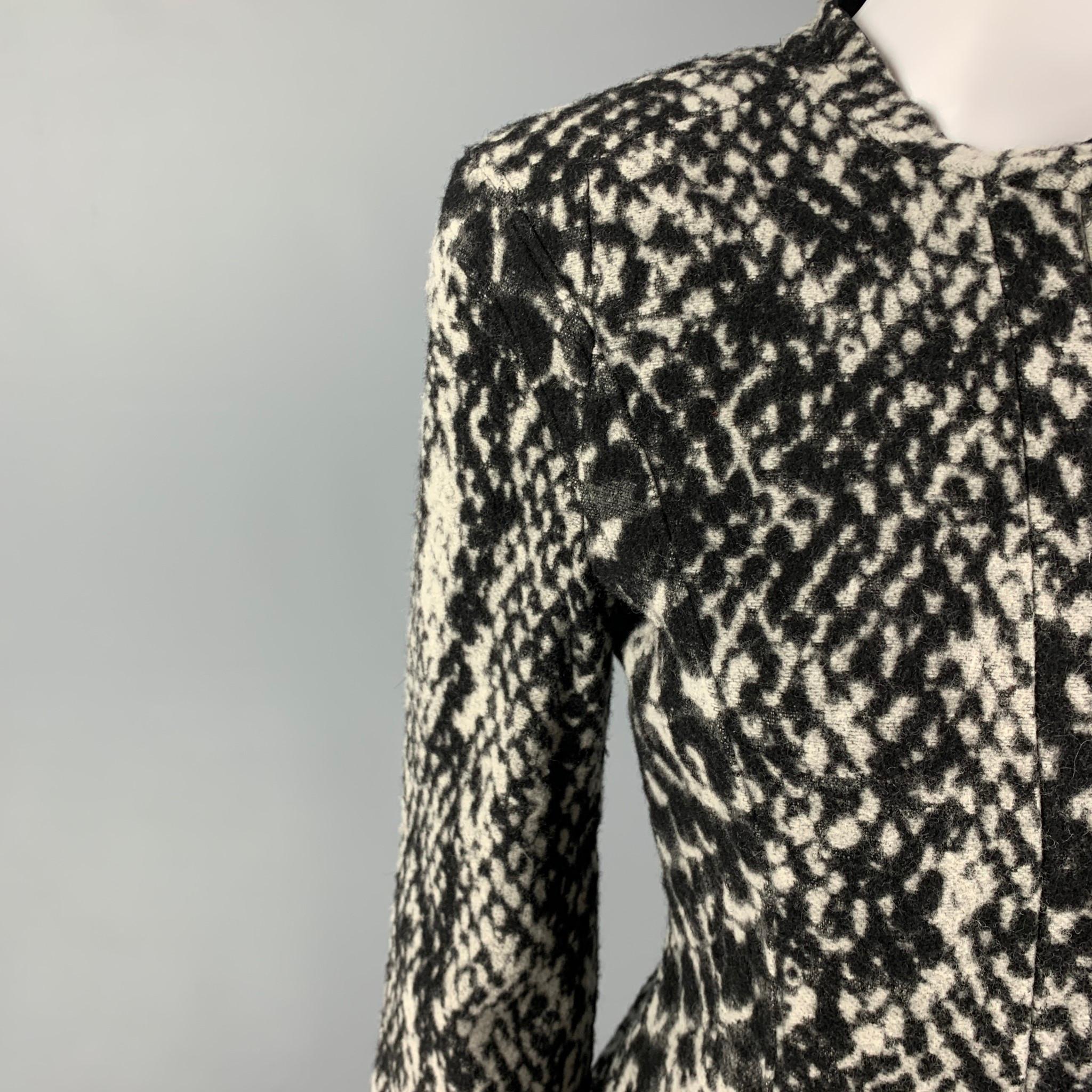 GIORGIO ARMANI jacket comes in a grey & black animal print material featuring a collarless style, strap collar detail, and a hidden zipper closure. Made in Italy. 

Very Good Pre-Owned Condition. Fabric tag removed.
Marked: