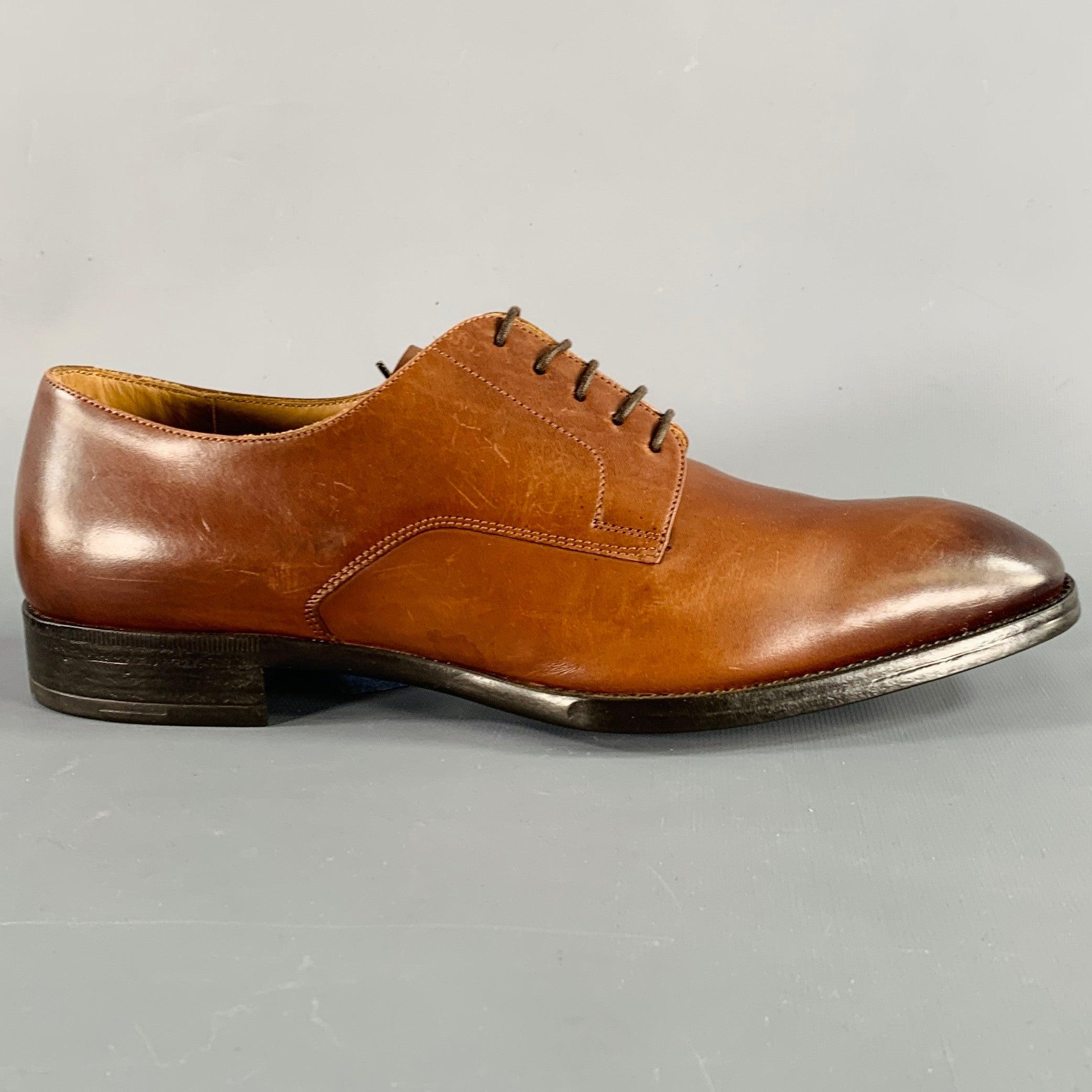 GIORGIO ARMANI shoes
in a brown leather featuring a derby style, rubber sole, and lace-up closure. Made in Italy.Very Good Pre-Owned Condition. 

Marked:   X2C536 6.5Outsole:11.25 inches  x 4 inches 
  
  
 
Sui Generis Reference: 136669
Category: