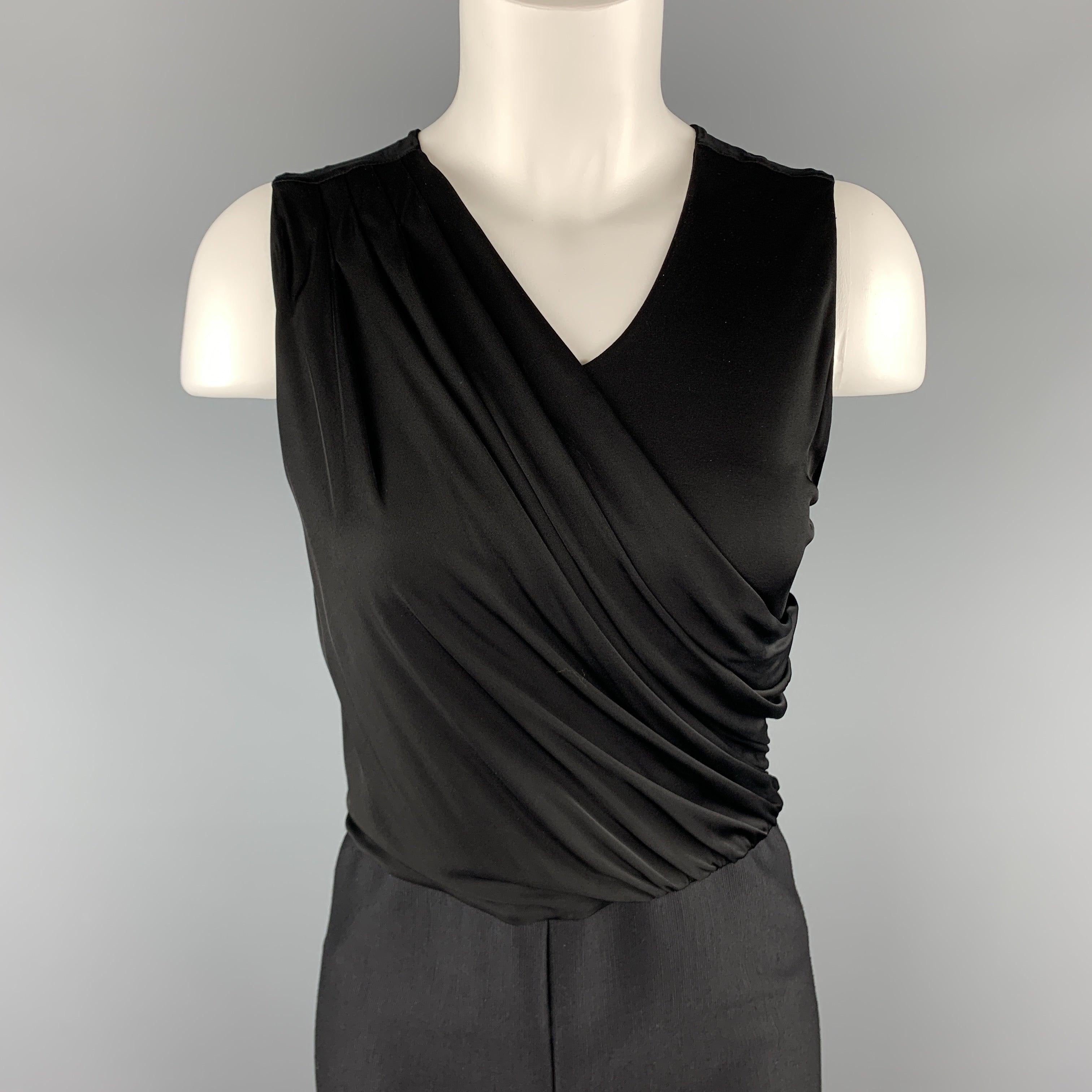 GIORGIO ARMANI jumpsuit features a sleeveless V neck top with an asymmetrical drape and wide leg textured wool blend pant bottom with a thick tuxedo stripe. Made in Italy.Excellent
Pre-Owned Condition. 

Marked:   IT 44 

Measurements: 
 
Shoulder: