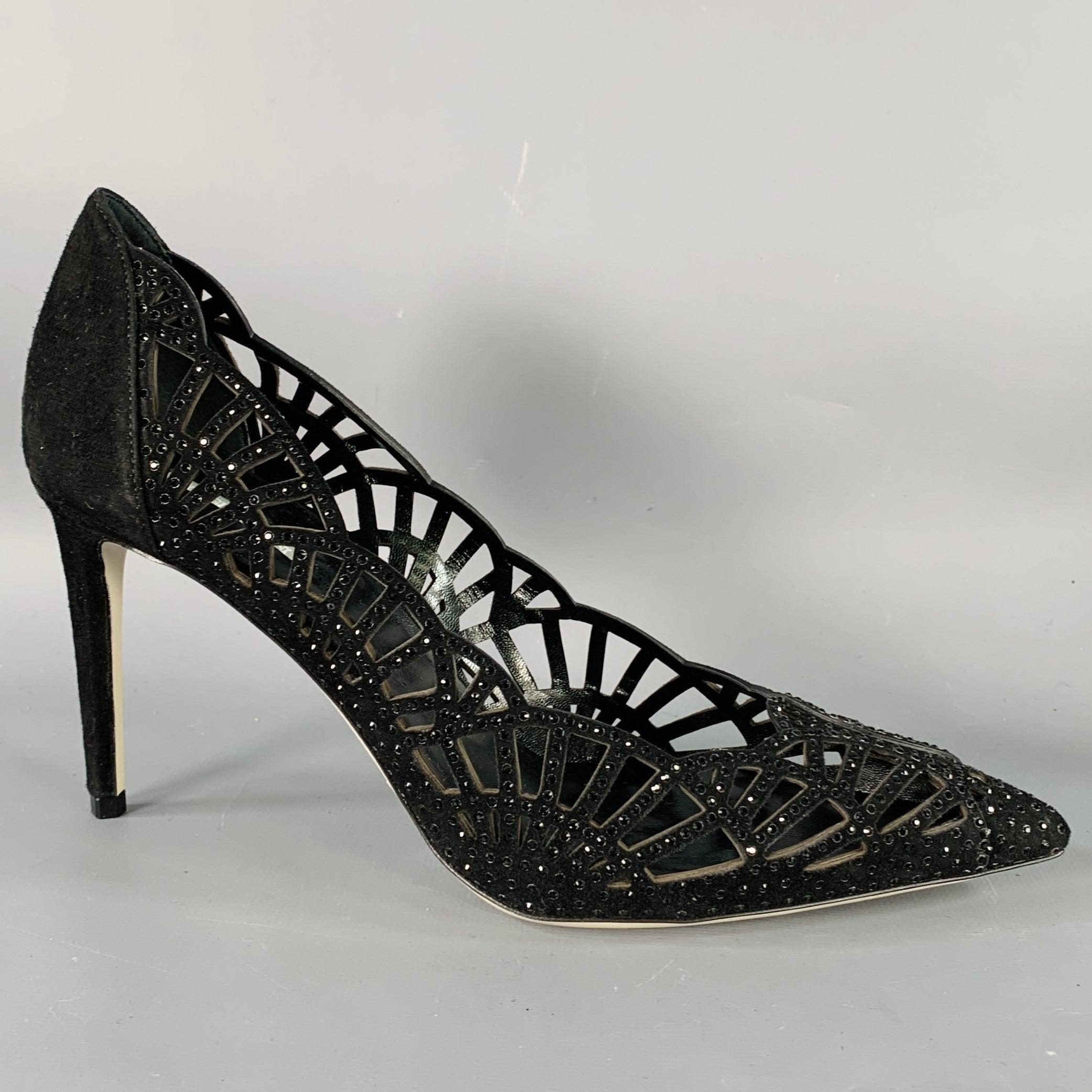 GIORGIO ARMANI pumps
in a black suede featuring a cutout design with rhinestones, stiletto heel, and slip on closure. Made in Italy.Very Good Pre-Owned Condition. 

Marked:   IT 38 

Measurements: 
  Heel: 3.5 inches  
  
  
 
Sui Generis