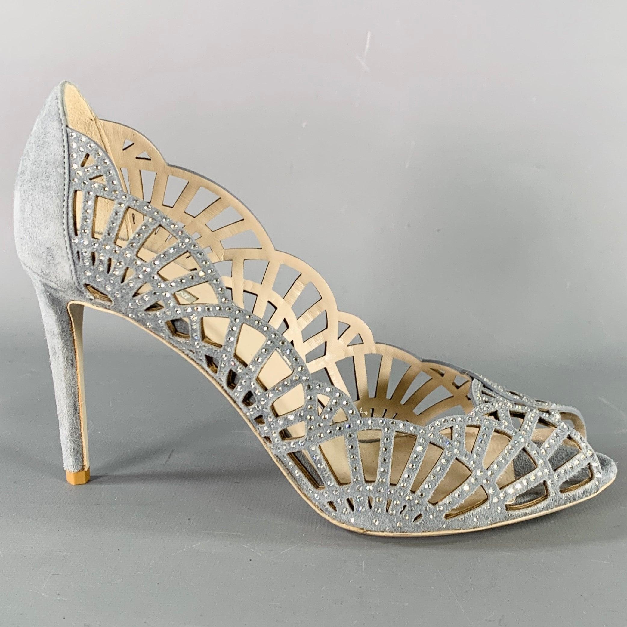 GIORGIO ARMANI pumps
in a
grey suede featuring a cutout design with rhinestones. Made in Italy.New without Box. 

Marked:   IT 38 

Measurements: 
  Heel: 3.5 inches 
  
  
 
Sui Generis Reference: 135787
Category: Pumps
More Details
    
Brand: 