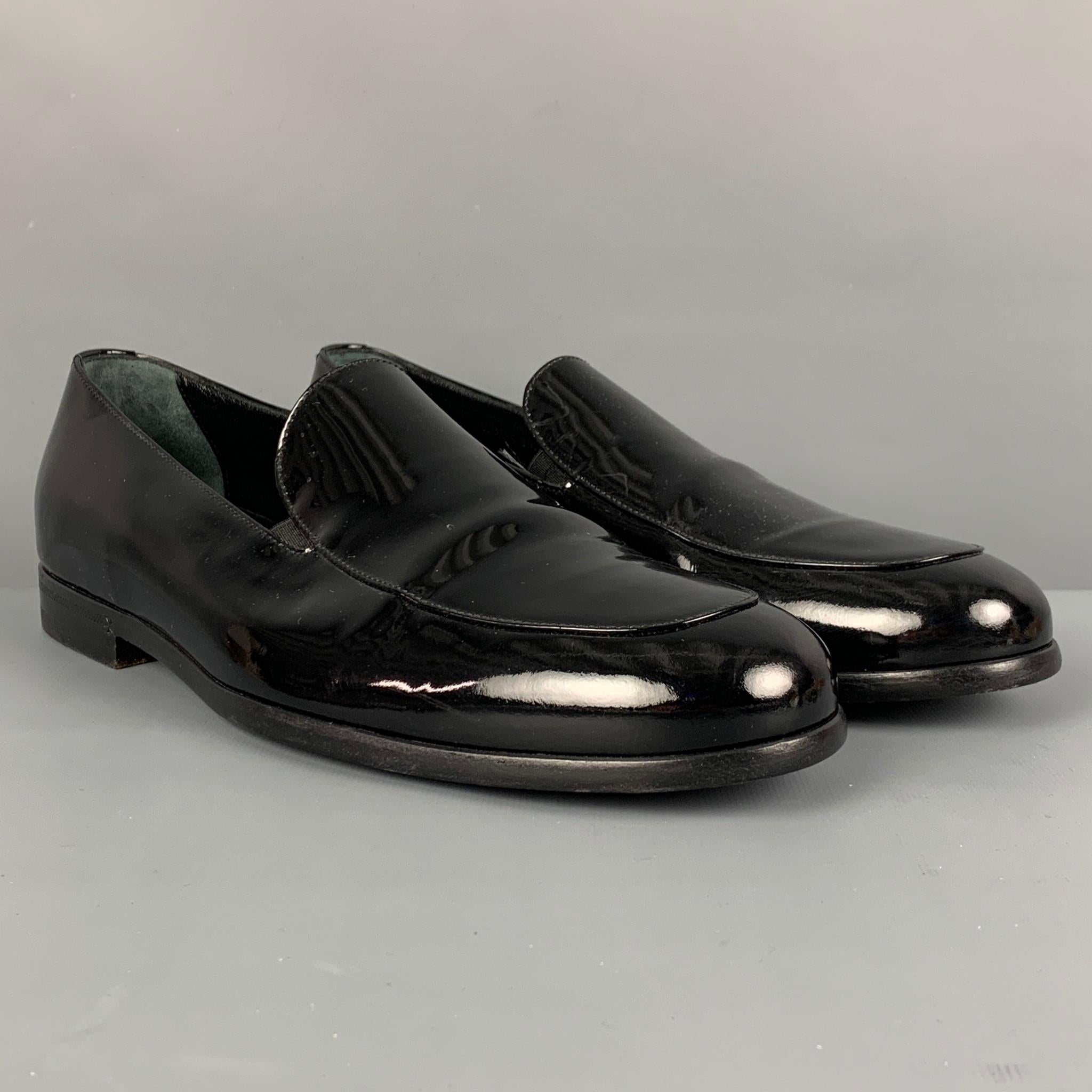 GIORGIO ARMANI loafers comes in a black patent leather featuring a slip on style. Made in Italy. 

Very Good Pre-Owned Condition.
Marked: XGU874 911 41.5

Outsole: 11.25 in. x 4 in. 