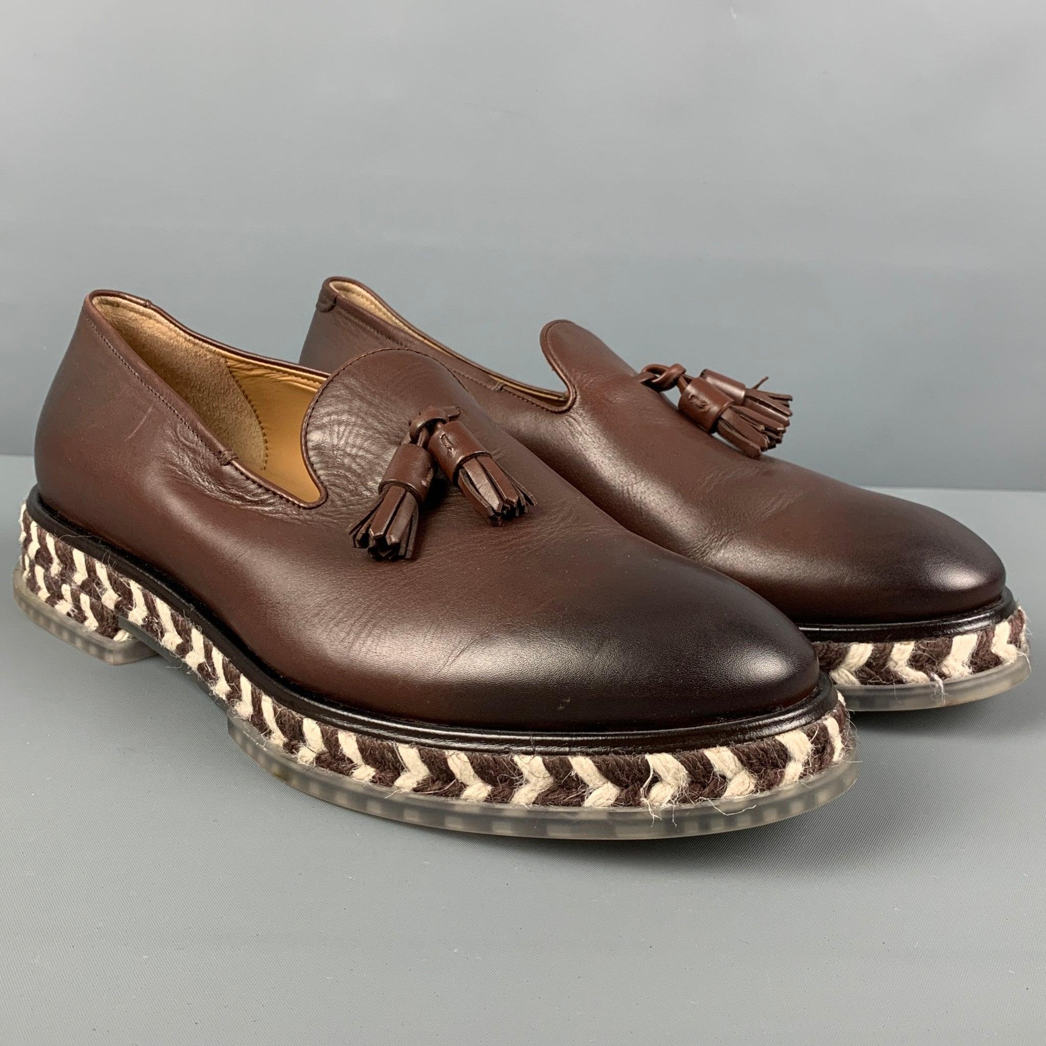 GIORGIO ARMANI loafers comes in a brown antique leather featuring a slip on style, tassel details, jute rope trim, and a rubber sole. Made in Italy.
Very Good
Pre-Owned Condition. 

Marked:   X2J1153 8.5Outsole: 12.25 inches  4.5 inches 
  
  

