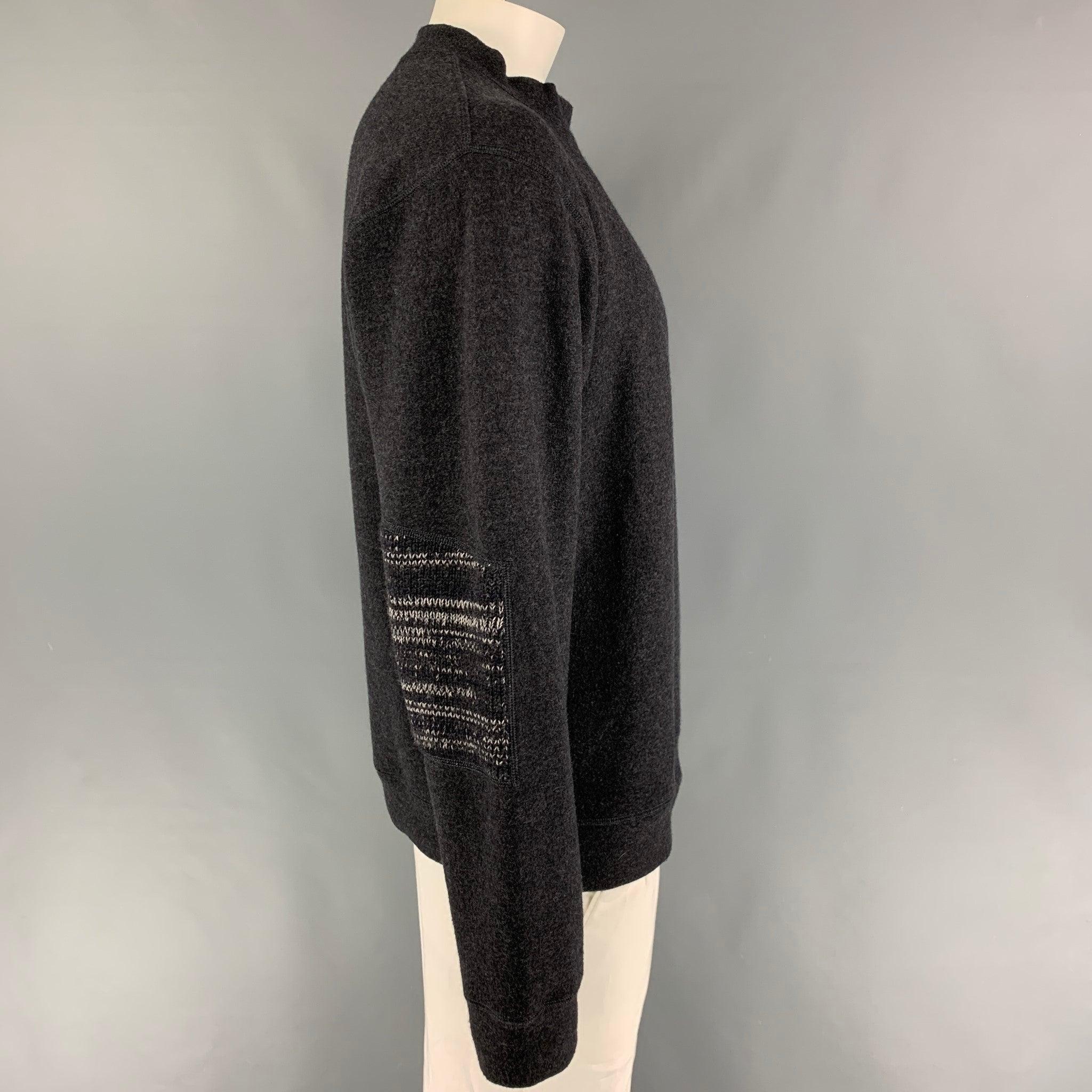 GIORGIO ARMANI sweater comes in a gray wool 
 featuring a mock neck and knitted elbow details. Made in Italy.
 Very Good
 Pre-Owned Condition. 
 

 Marked:  52 
 

 Measurements: 
  
 Shoulder: 22 inches Chest:
 42 inches Sleeve: 28 inches Length: