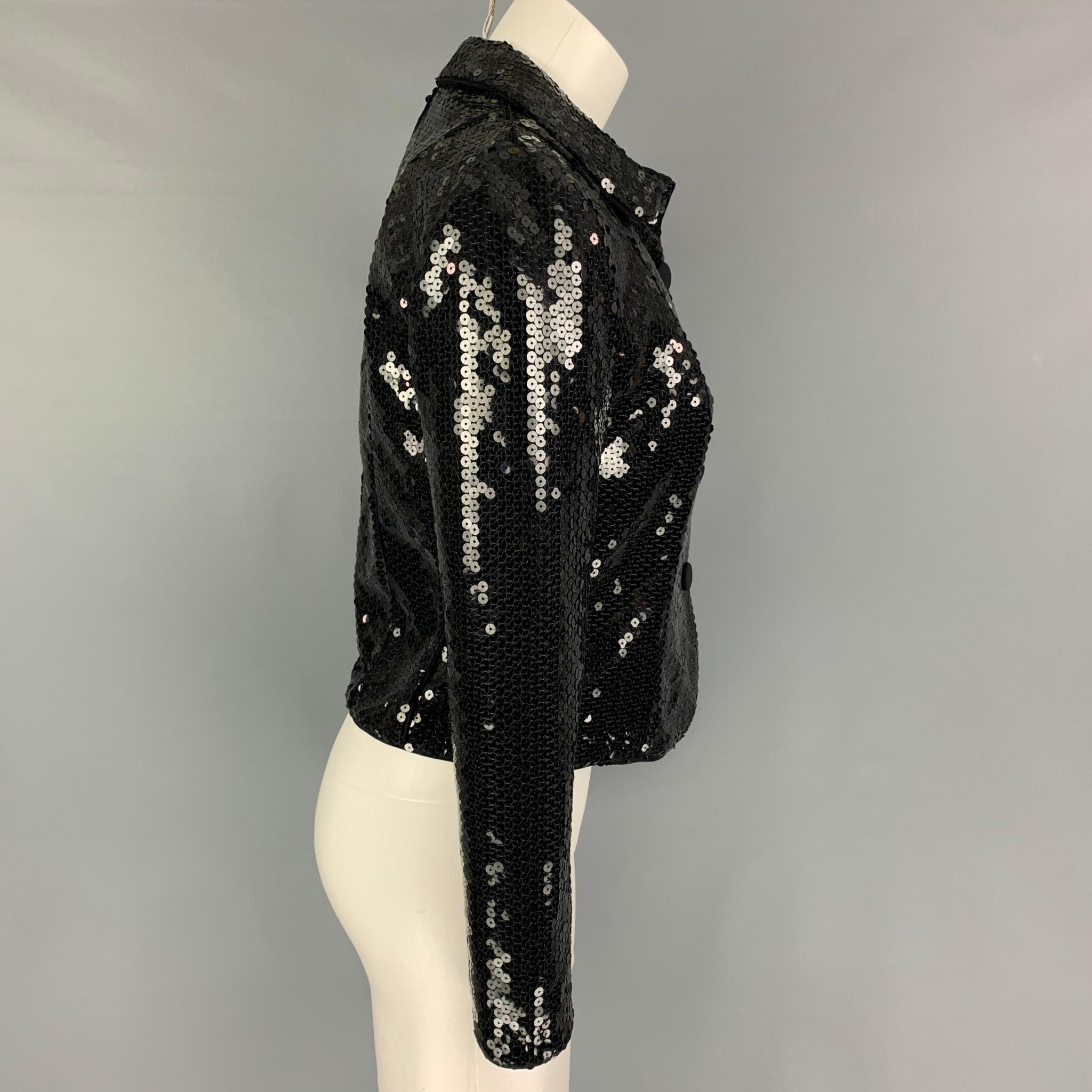GIORGIO ARMANI jacket comes in a black sequined material featuring a spread collar and a snap button closure. Made in Italy. 

Very Good Pre-Owned Condition. Fabric tag removed.
Marked: Size tag removed.

Measurements:

Shoulder: 15.5 in.
Bust: 34