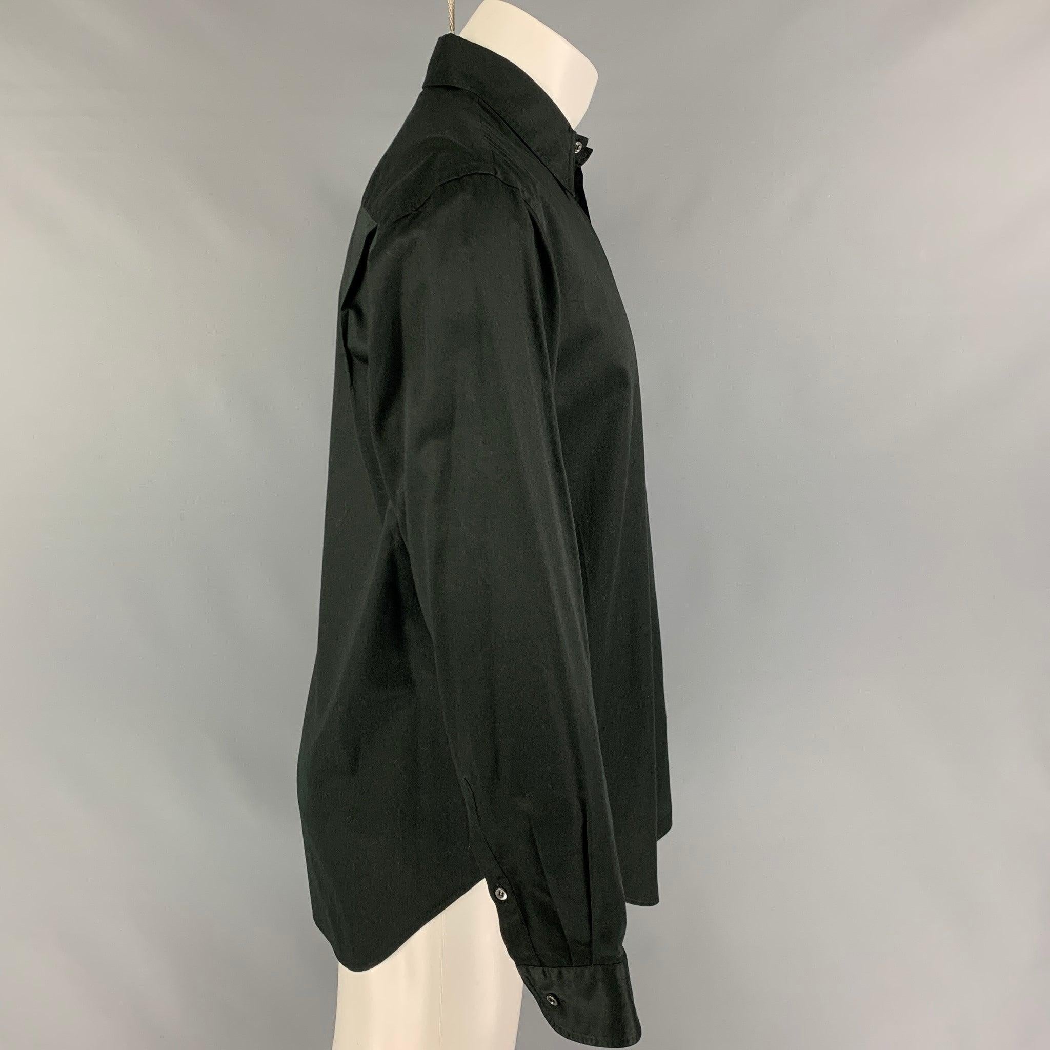 GIORGIO ARMANI long sleeve shirt comes in a black cotton featuring a pointed collar, patch pocket, and a button up closure. Made in Italy.
 Very Good
 Pre-Owned Condition.  
 

 Marked:  39/15.5 
 

 Measurements: 
  
 Shoulder: 19 inches Chest: 42
