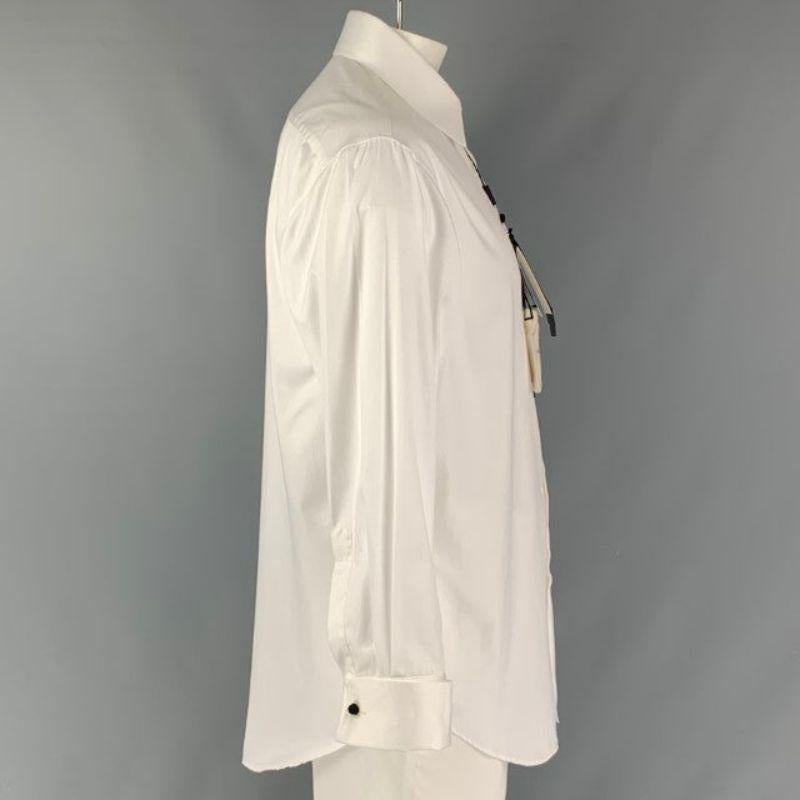 GIORGIO ARMANI long sleeve shirt comes in white cotton poplin fabric, spread collar, chinese knot button shirt, french cuff and button down front.
  Made in Italy.New with Tags. 
 

 Marked:  XXL 
 

 Measurements: 
  
 Shoulder: 20.5 inChest: 49