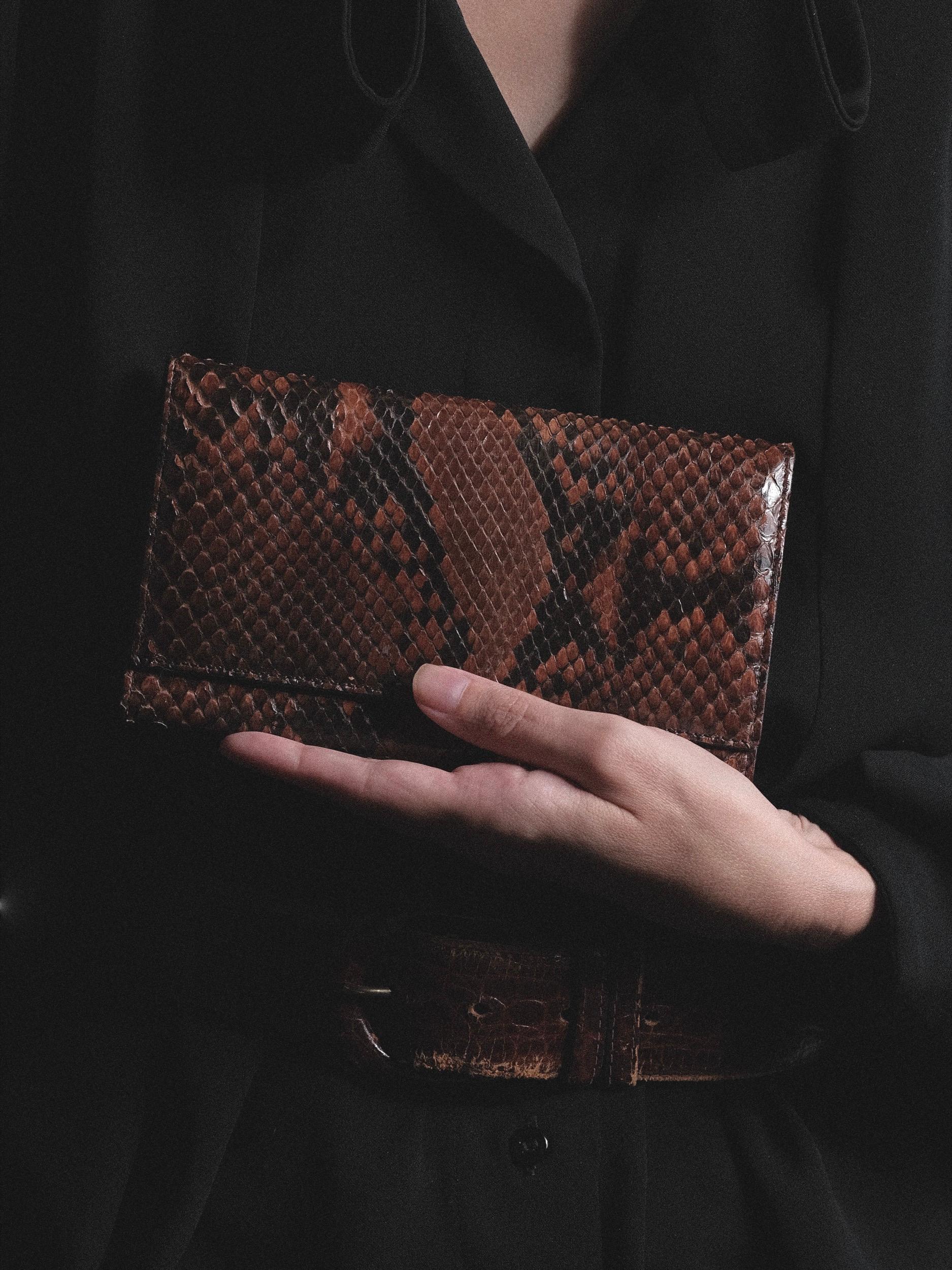 Giorgio Armani Snakeskin Wallet Long Continental Style

Brown and Black Snakeskin

Black buttery soft leather interior

Smooth snakeskin outer, no logos or labels except the tonal debossed Giorgio Armani signature inside

Length 7 inches
Width 4
