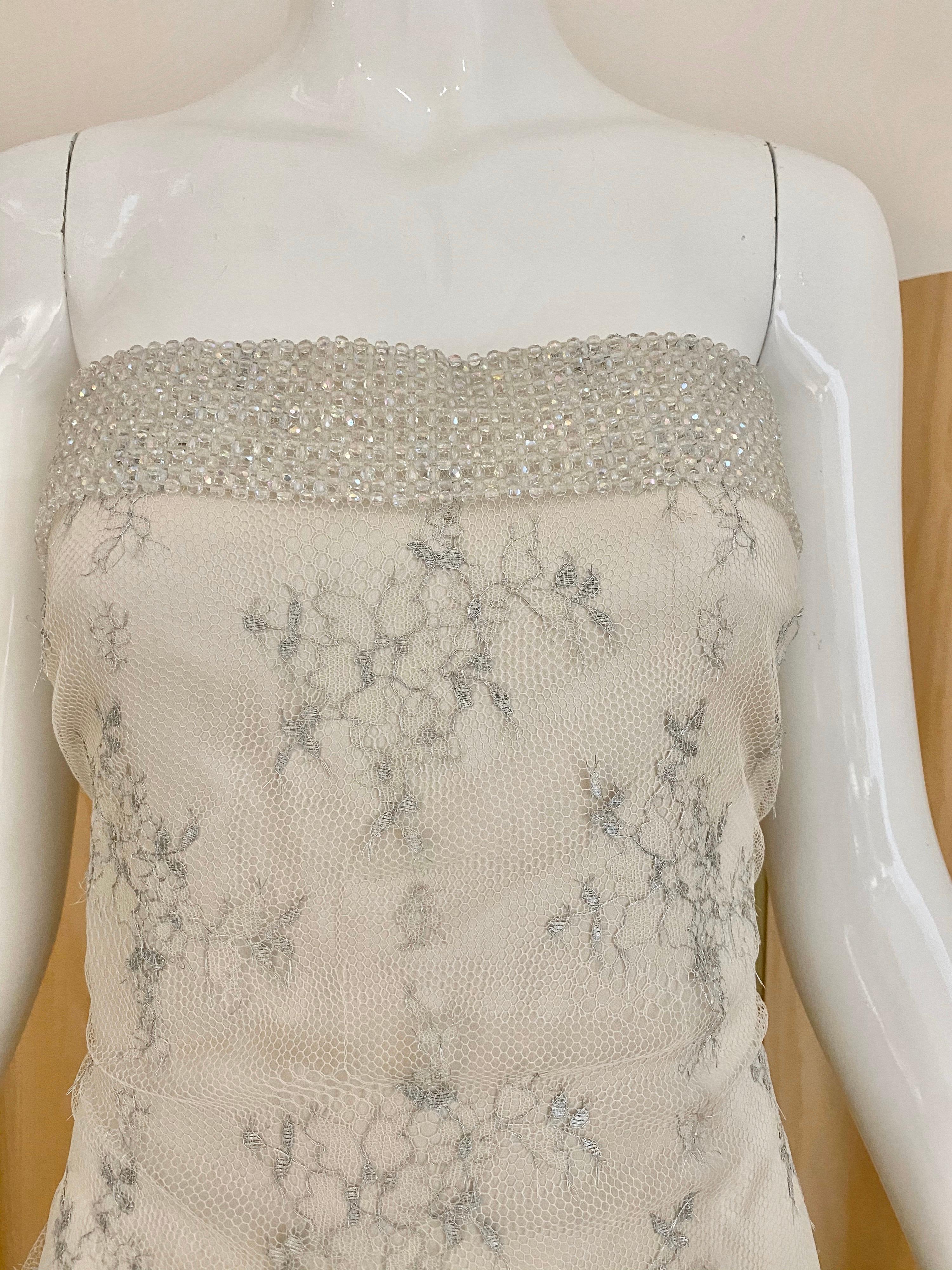 Beautiful Giorgio Armani Strapless white and silver lace gown with iridescent beads.
Lace has beautiful silver grey embroidery. Perfect for wedding or rehearsal dinner .
Fit size : Medium
Bust: 40”/ Waist: 36” / Hip: 38”/ Dress: Length: 54”