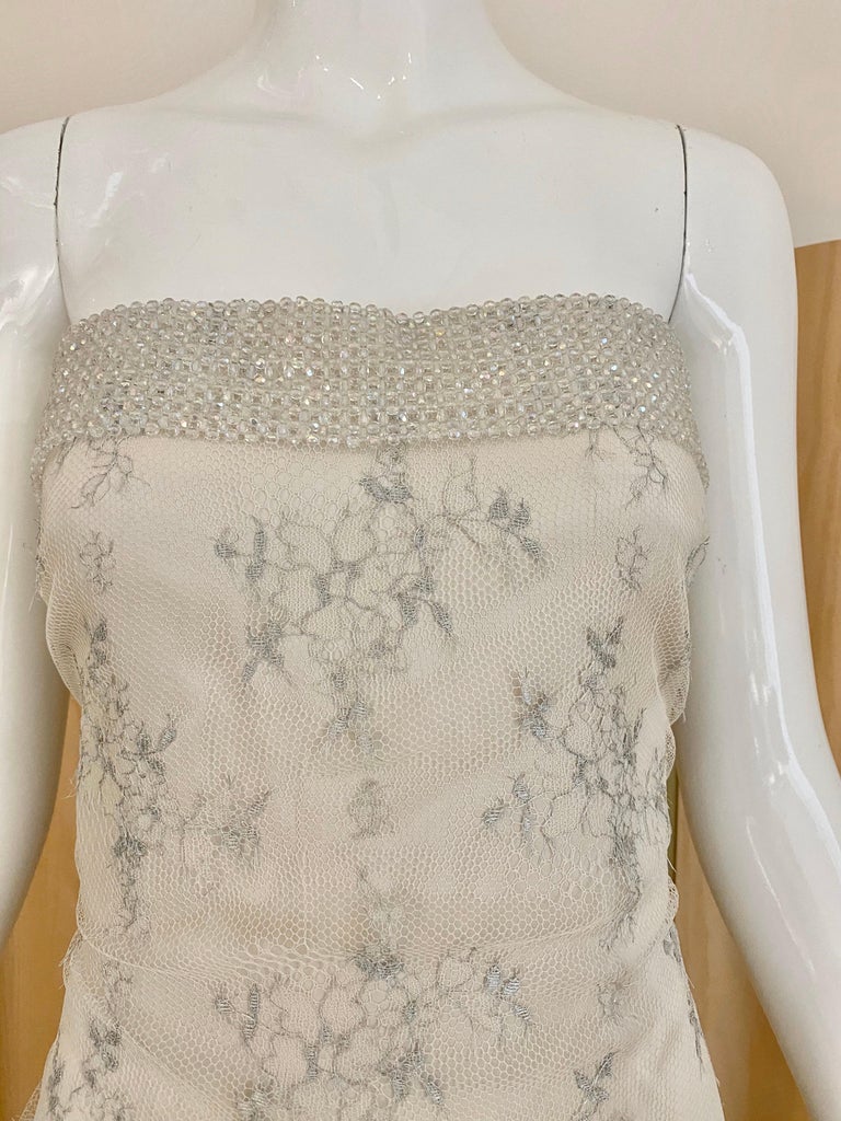 Beautiful Giorgio Armani Strapless white and silver lace gown with iridescent beads.
Lace has beautiful silver grey embroidery. Perfect for bridal gown.
Fit size : Medium
Bust: 40”/ Waist: 36” / Hip: 38”/ Dress: Length: 54”