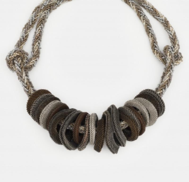 Add the Giorgio Armani finish to your ensemble of the day with this necklace. Made from three-tone metal, it has bead details and mesh rings. A toggle clasp completes the design.
