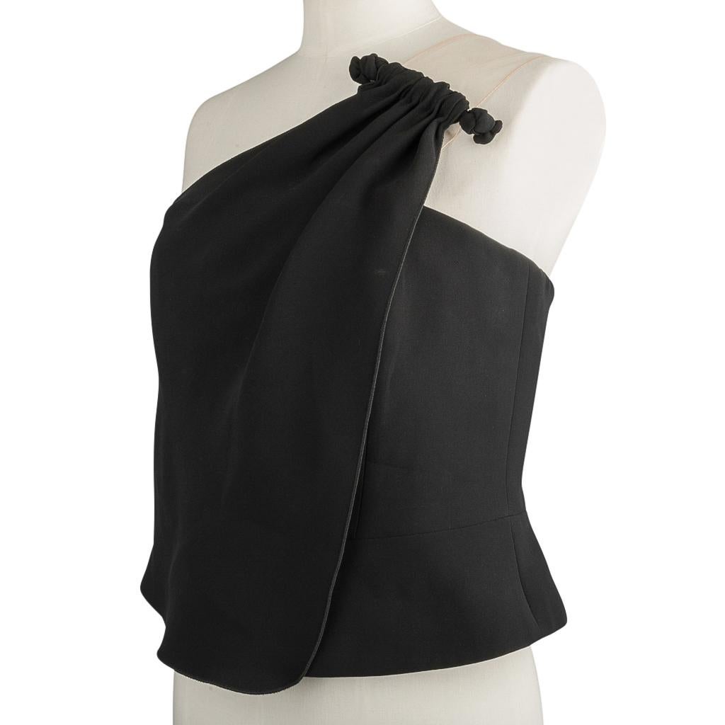 Guaranteed authentic Giorgio Armani faux wrap one shoulder black bustier style top with lovely details.
Beautiful with nude mesh 1 shoulder strap. Please see image showing label to see actual mesh.  It is very 
difficult to photograph.
Asymmetrical