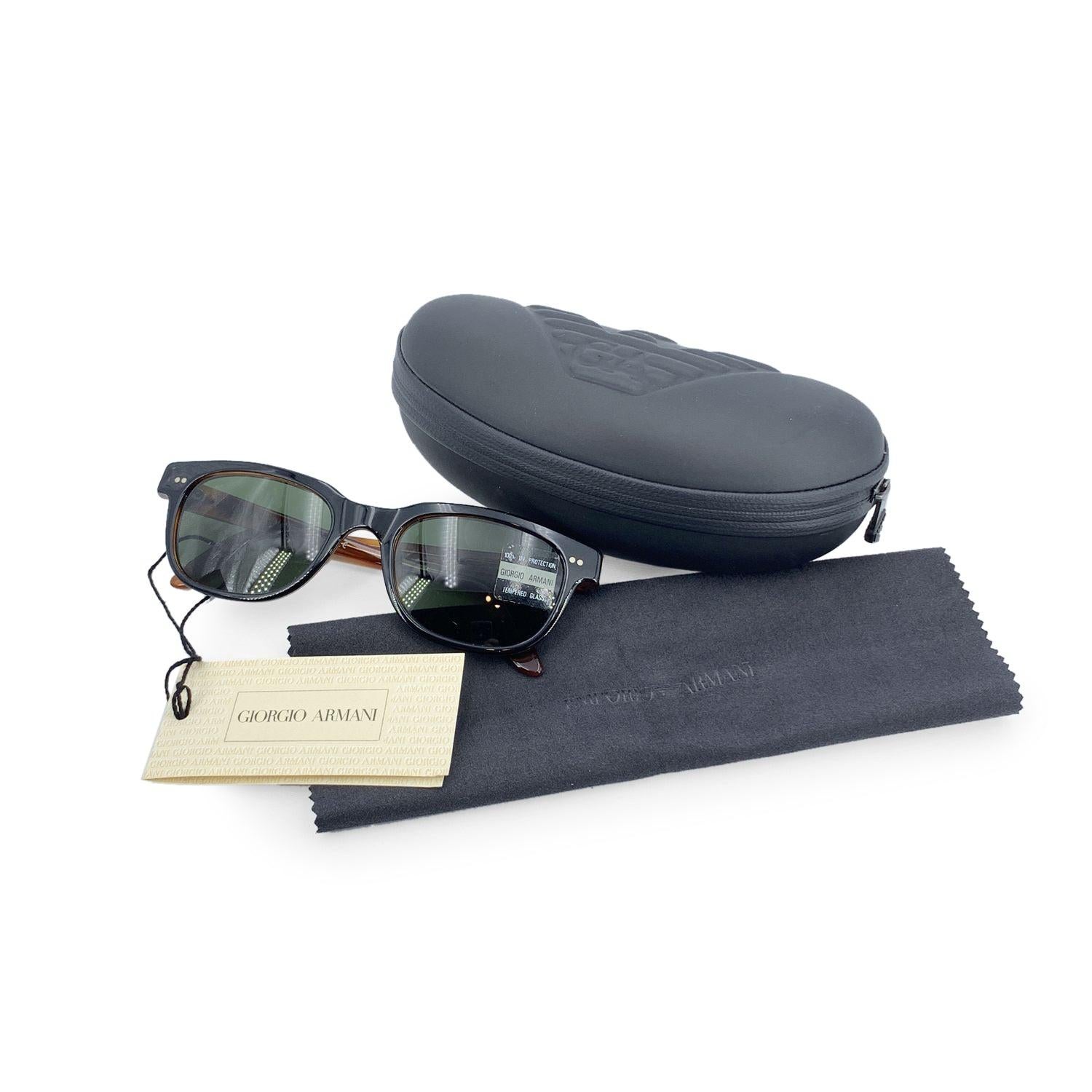 Vintage Giorgio Armani Unisex Sunglasses, Mod. '376-S' - 227 - 51/12 - 140 mm. Black acetate rectangular shaped frame with brown interior and ear stem. Green tempered glass lenses with 100% UV protection. Made in Italy. Details MATERIAL: Plastic