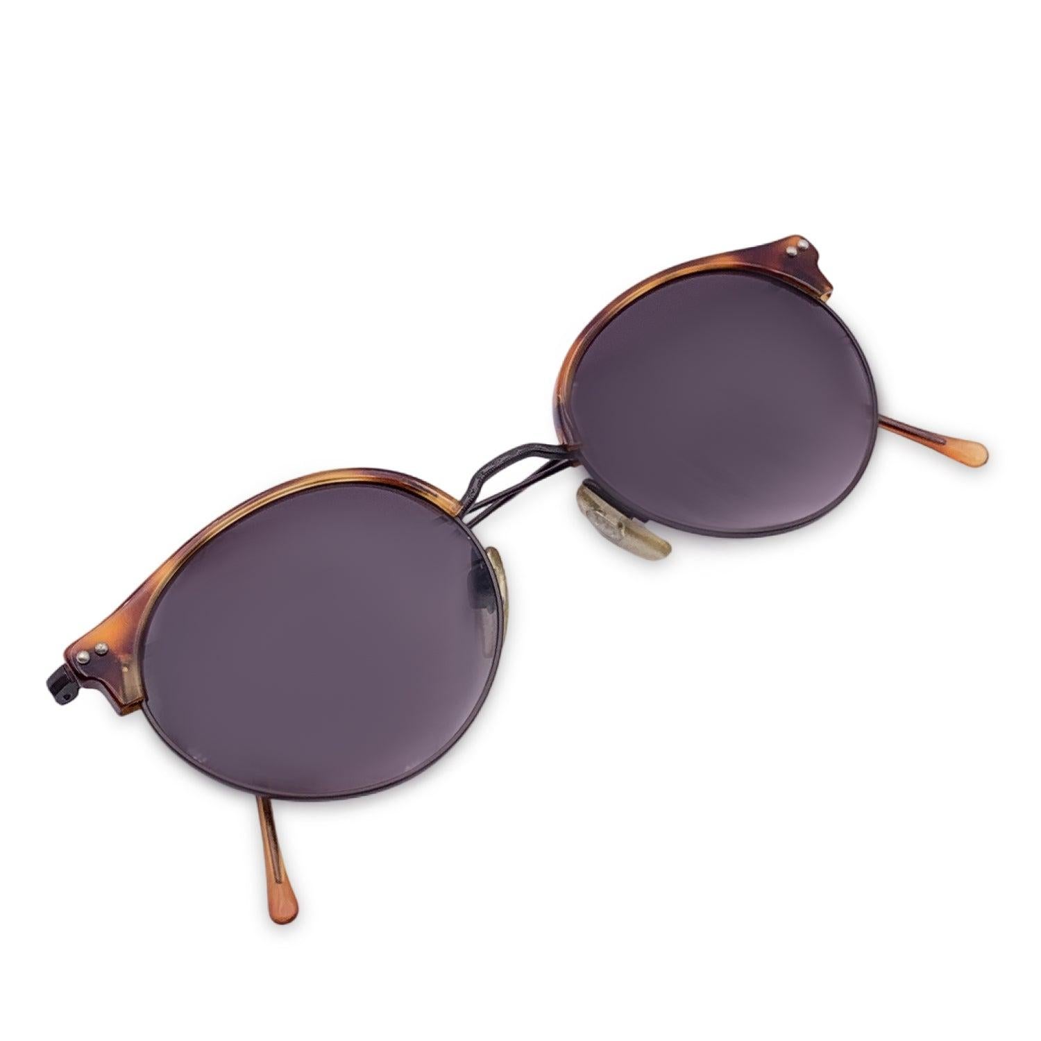 Vintage Giorgio Armani Brown sunglasses. Model. 377 col. 015. Size: 47/20 140mm. Dark brown metal frame, with brown tortoise acetate detail on the upper frame. 100% Total UVA/UVB protection .Gradient Brown lenses. Details MATERIAL: Metal COLOR: