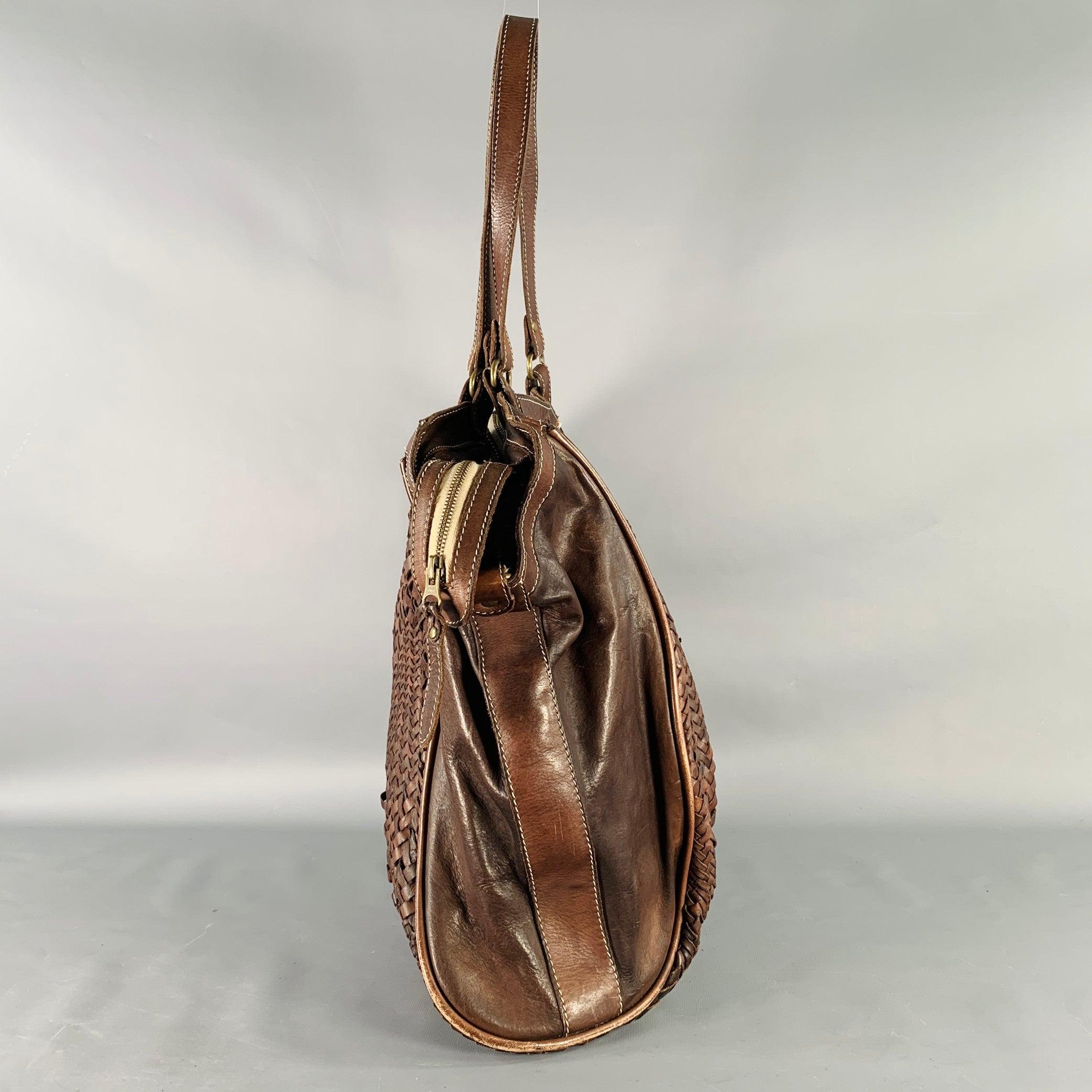 GIORGIO BRATO tote
in a brown leather featuring a woven design, top handles, and zip closure.Very Good Pre-Owned Condition. Signs of wear on corners and in weaving. This item was consigned without the removable shoulder strap. 

Measurements: 
 