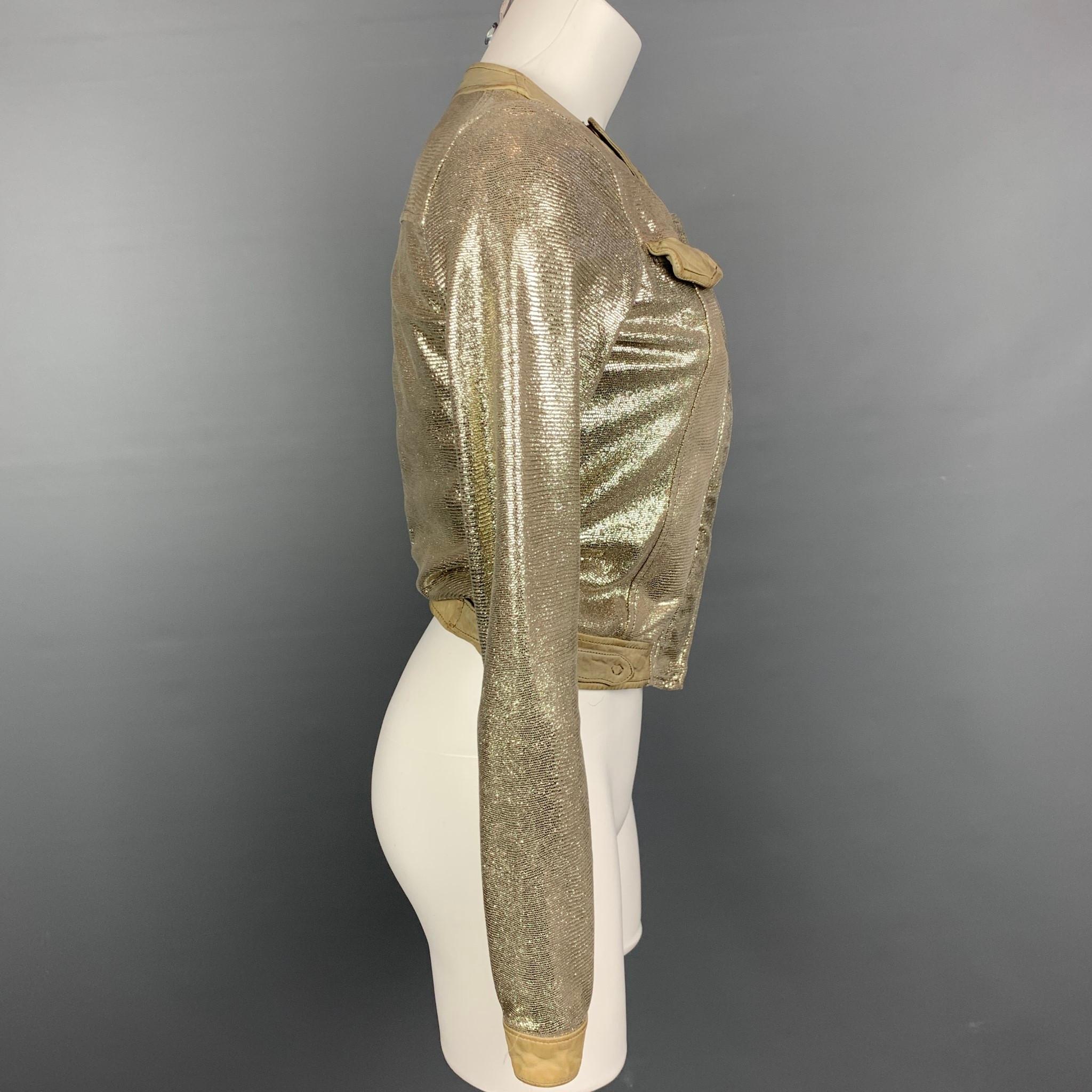 GIORGIO BRATO jacket comes in a taupe metallic textured leather featuring a collarless style, flap pockets, and a hidden zip up closure. Made in Italy.

Good Pre-Owned Condition.
Marked: 40

Measurements:

Shoulder: 14 in.
Bust: 32 in.
Sleeve: 26
