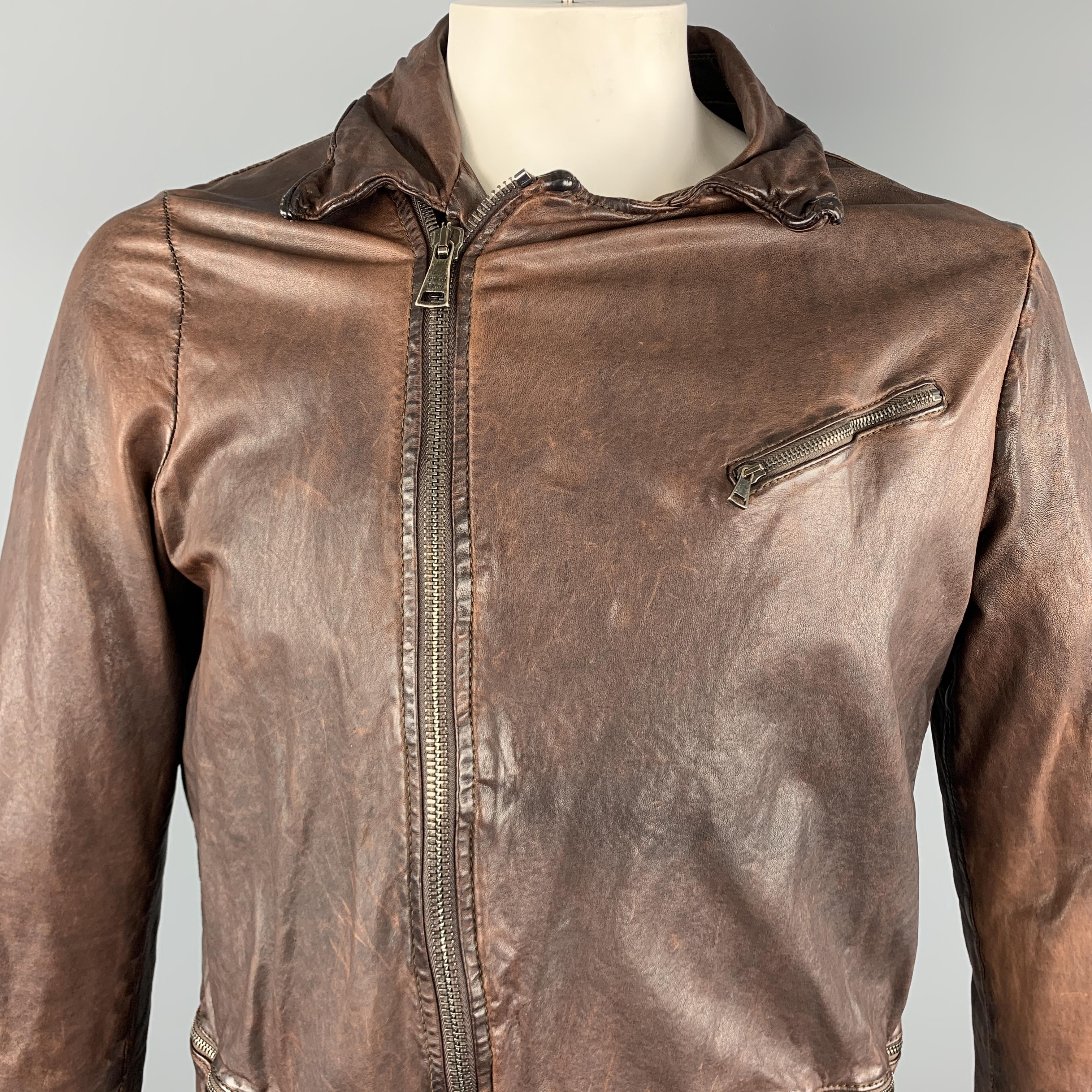 GIORGIO BRATO jacket comes in a brown wrinkled leather featuring zip cuff, zipper pockets, and a full zip closure. Made in Italy.

Very Good Pre-Owned Condition.
Marked: 50

Measurements:

Shoulder: 16.5 in. 
Chest: 44 in. 
Sleeve: 27 in. 
Length: