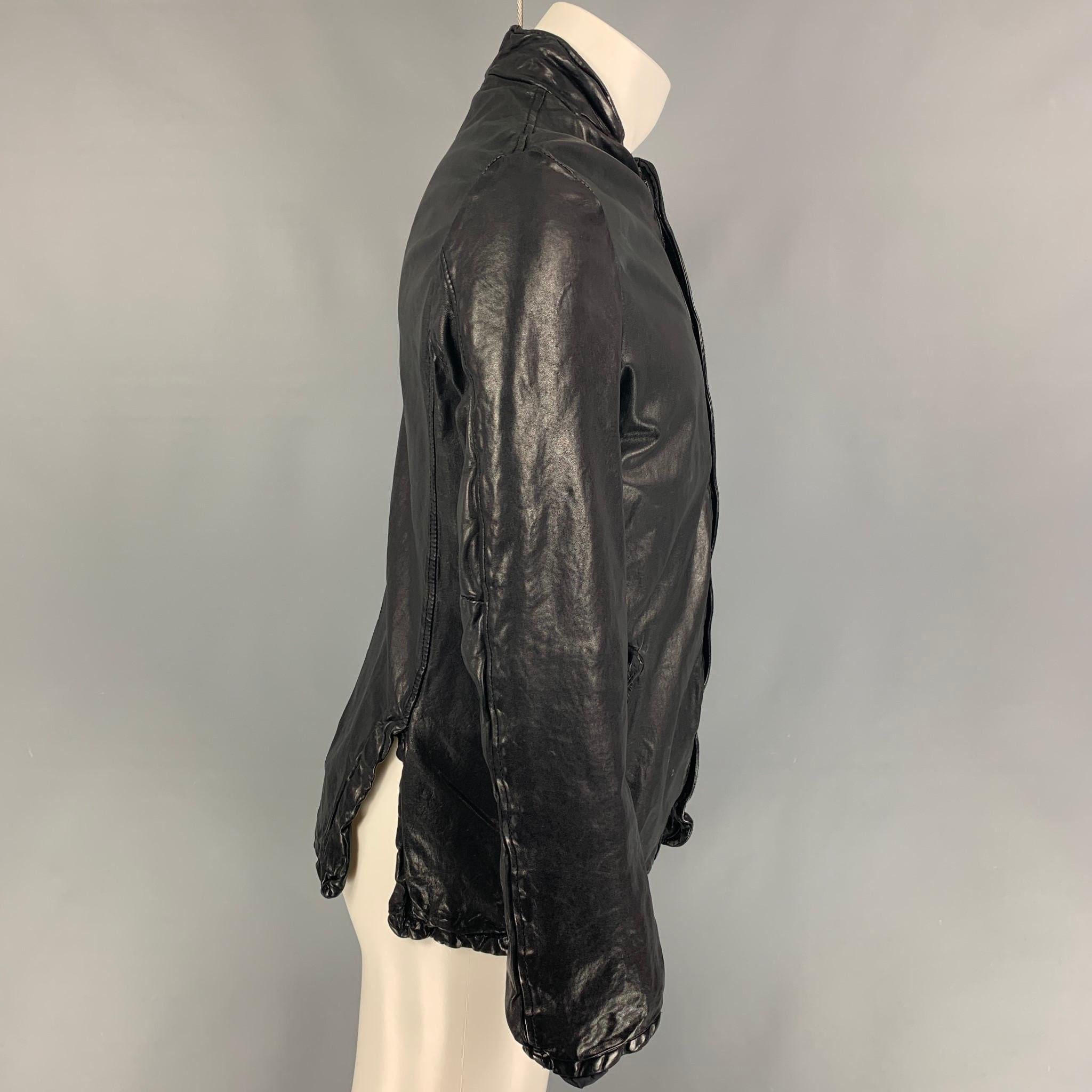 GIORGIO BRATO jacket comes in a black leather featuring a stand up collar, front pockets, and a hidden zip up closure. Made in Italy.

Very Good Pre-Owned Condition.
Marked: 52

Measurements:

Shoulder: 18 in.
Chest: 40 in.
Sleeve: 25 in.
Length: 26