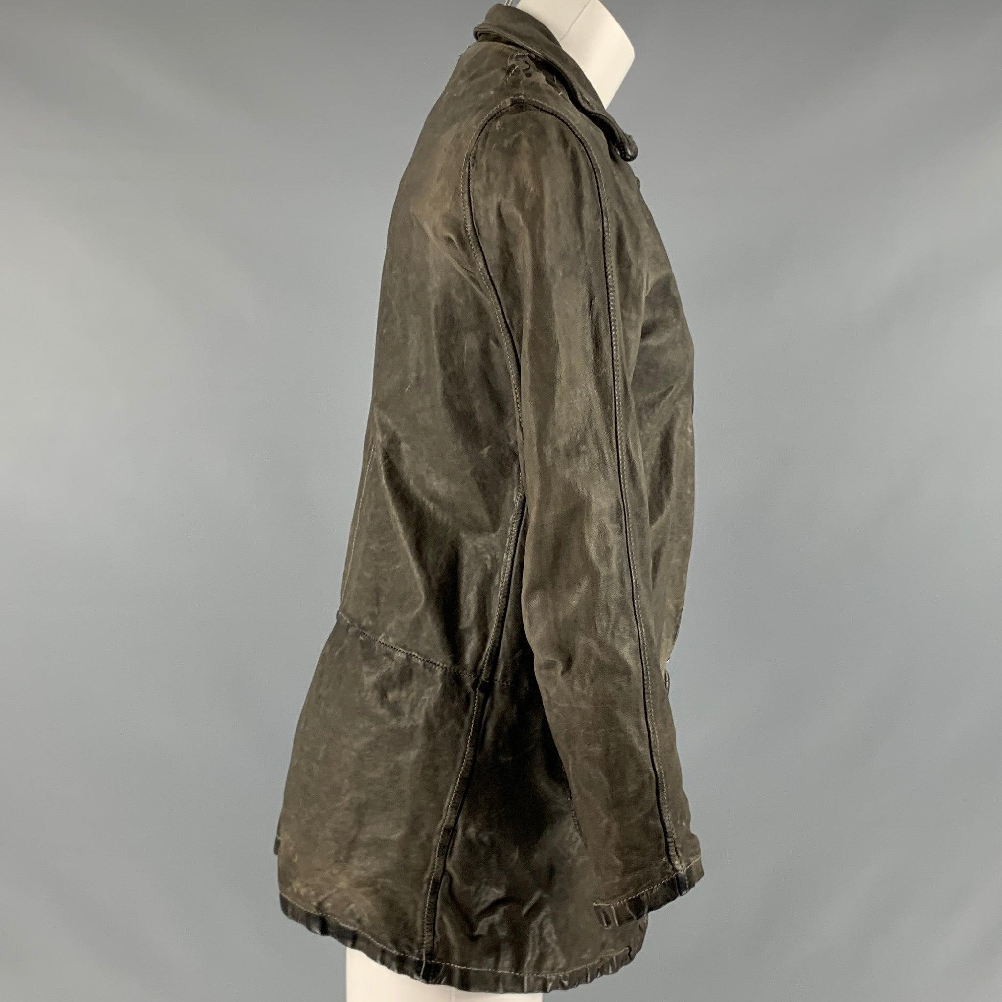 GIORGIO BRATO jacket
in a
grey vegetable tan leather featuring a distressed style, zipper pockets, and a zip up closure. Handmade in Italy.Excellent Pre-Owned Condition. 

Marked:   42 

Measurements: 
 
Shoulder: 15 inches Bust: 32 inches Sleeve: