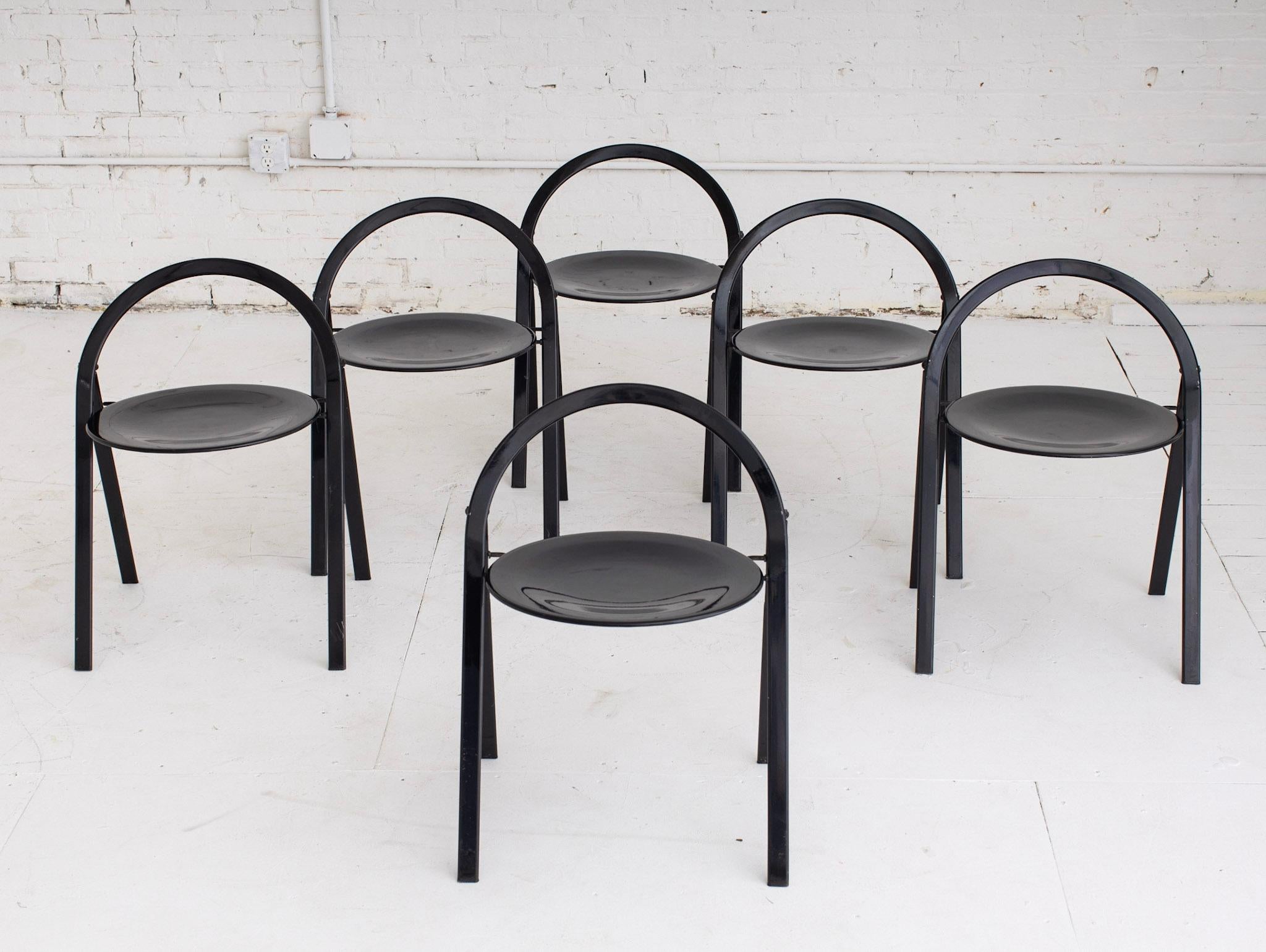 A set of 6 Giorgio Cattelan for Cidue folding chairs. Sleek round resign in black enamel. 

Cattelan was born in Thiene, Italy into a family of craftsmen. Prior to founding the luxury furniture company Cattelan Italia in 1979 with his wife, Silvia