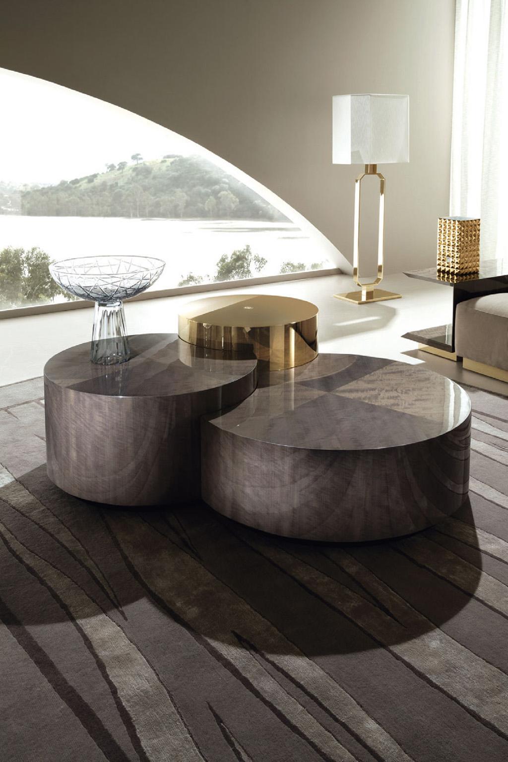 Infinity 3 level tier coffee table with soft round curves. 
Three levels cocktail table composed of:
- 2 lower small tables in makorè mahogany veneer with high gloss polyester finish.
- 1 higher small table in light gold chrome stainless steel with