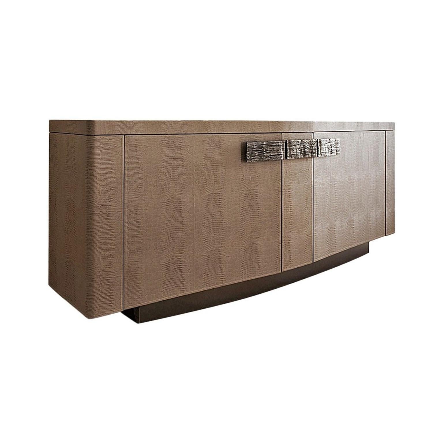 Two-door buffet in armadillo printed leather.
Brown emperador marble top insert with center drawer lined in leather.
Two interior adjustable glass shelves and two interior full extension drawers with bottom lined in armadillo printed leather.
LED