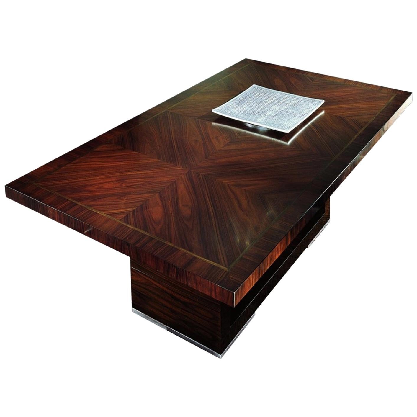 Rectangular table in Brazilian rosewood satin finish with Italian walnut inlay top with 2 extension of cm. 48 (19”) each.
Brushed steel accents on the base.
Art Deco 

Size 78’’ ½ W x 46’’ D x 30’’ H (closed)
Size 116’’ ½ W x 46’’ D x 30’’ H