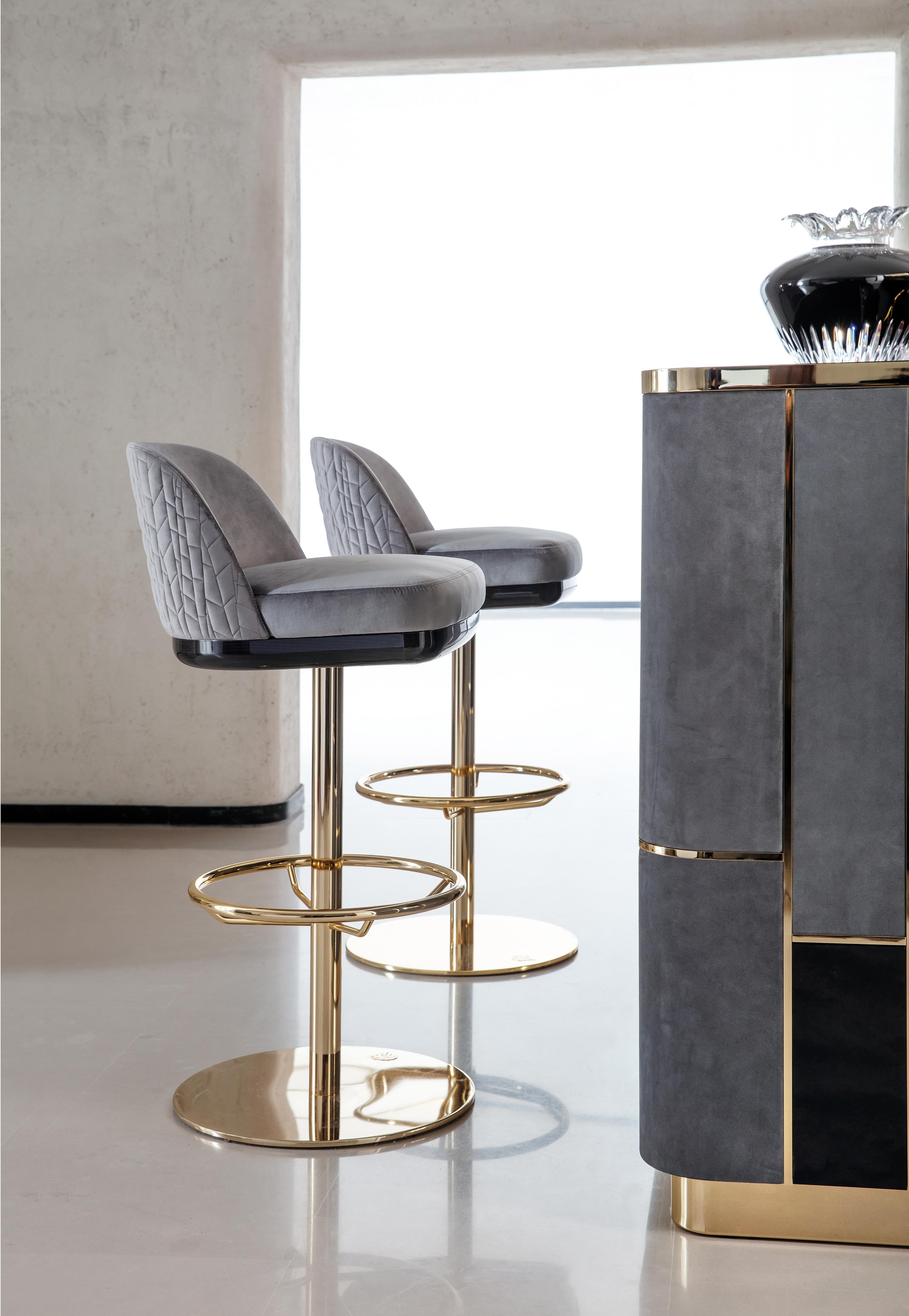 Giorgio Collection Charisma Bar Stool, an exquisite piece that embodies luxury and sophistication. Crafted with a stunning gold chrome stainless steel swivel base, this bar stool showcases the iconic Giorgio Collection logo, elevating your space