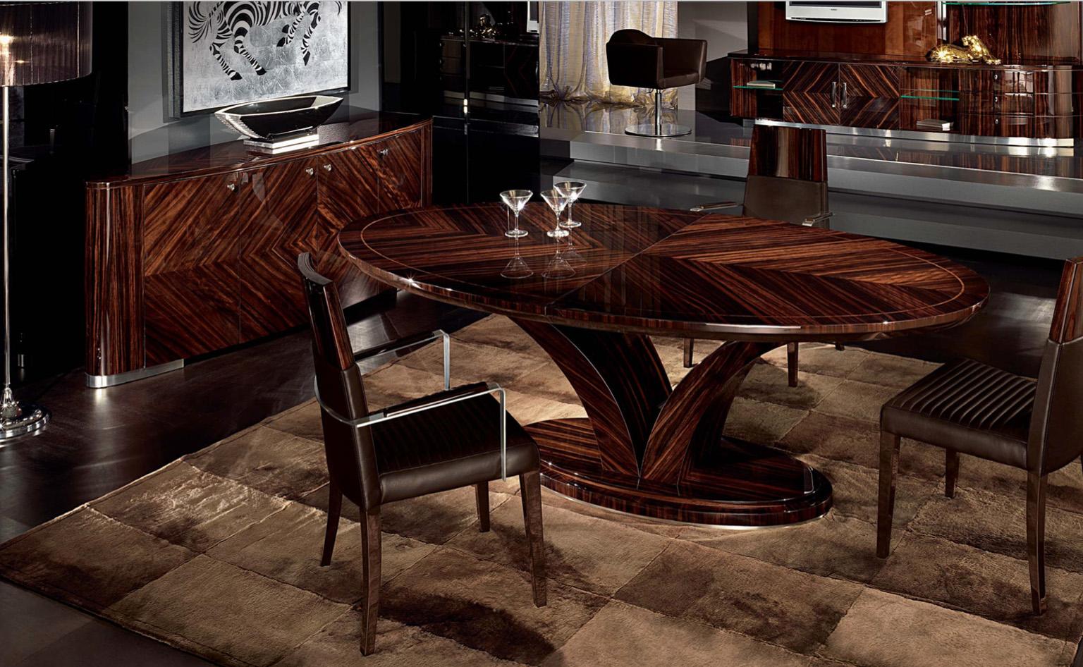 Oval dining table with one center leaf of cm 50 (19” ½), inlay top in Ebony Makassar with 6mm filet in Zebra veneer in high gloss polyester. Brushed and chrome stainless steel details.

Size: 86”½ W x 47”D x 30”H (closed)
Size: 106”½ W x 47”D x 30”H