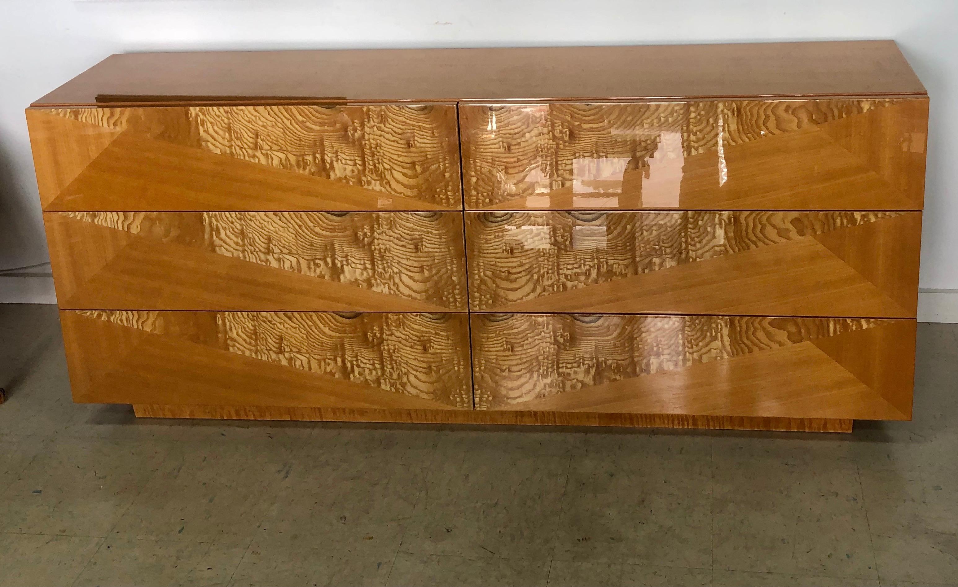 High quality craftsmanship of maple, bird’s eye maple, and exotic burl woods are finished in Italian High Gloss Polyester Polish. There are six full extension drawers.

 