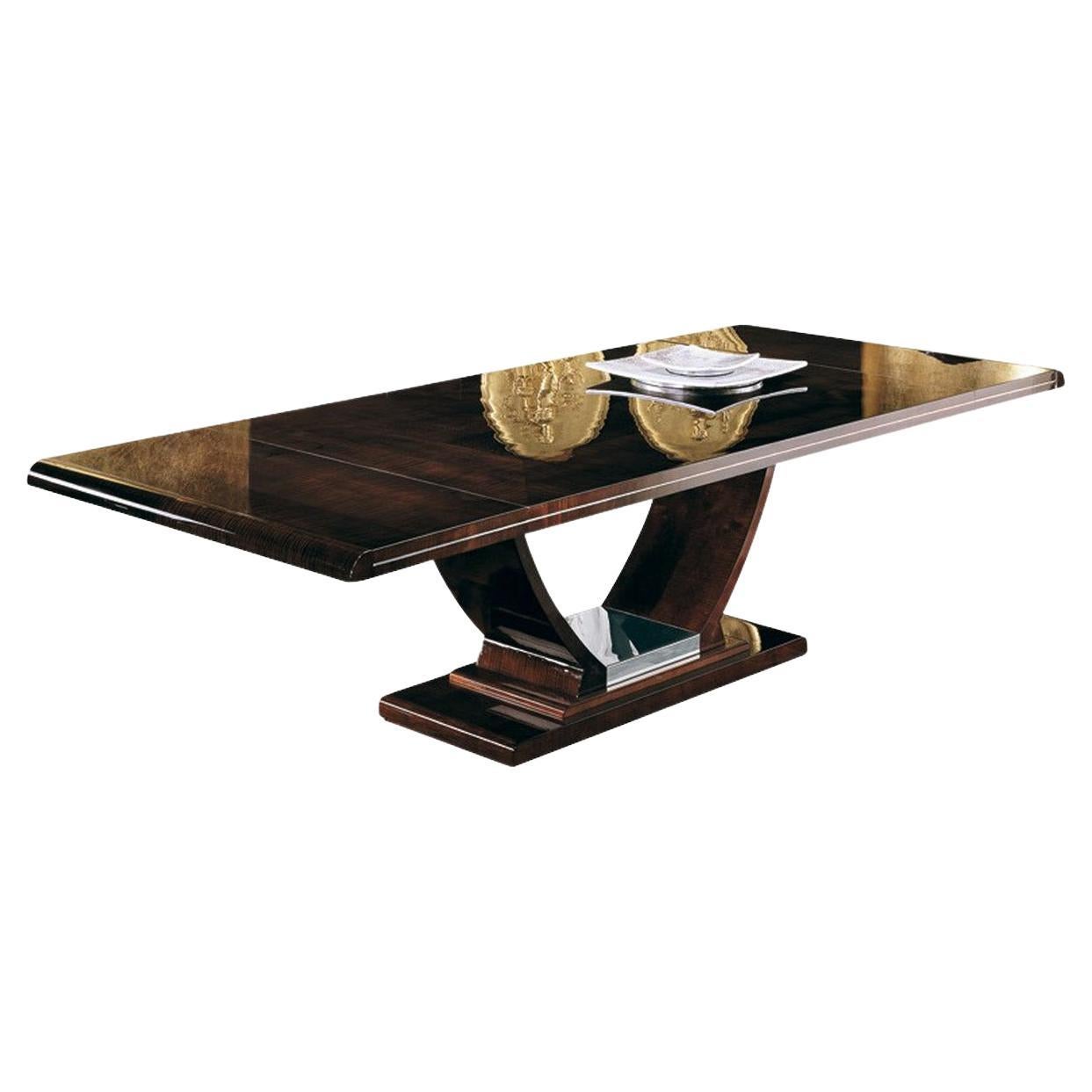 Rectangular table with two extension of cm 48 (19”) with top in ash-burl inlay and curly sycamore veneer in high gloss polyester, finish in dark moka tone and polished stainless steel chrome base.
Measures: 77” L x 46” W x 30” H (closed)
113” L x