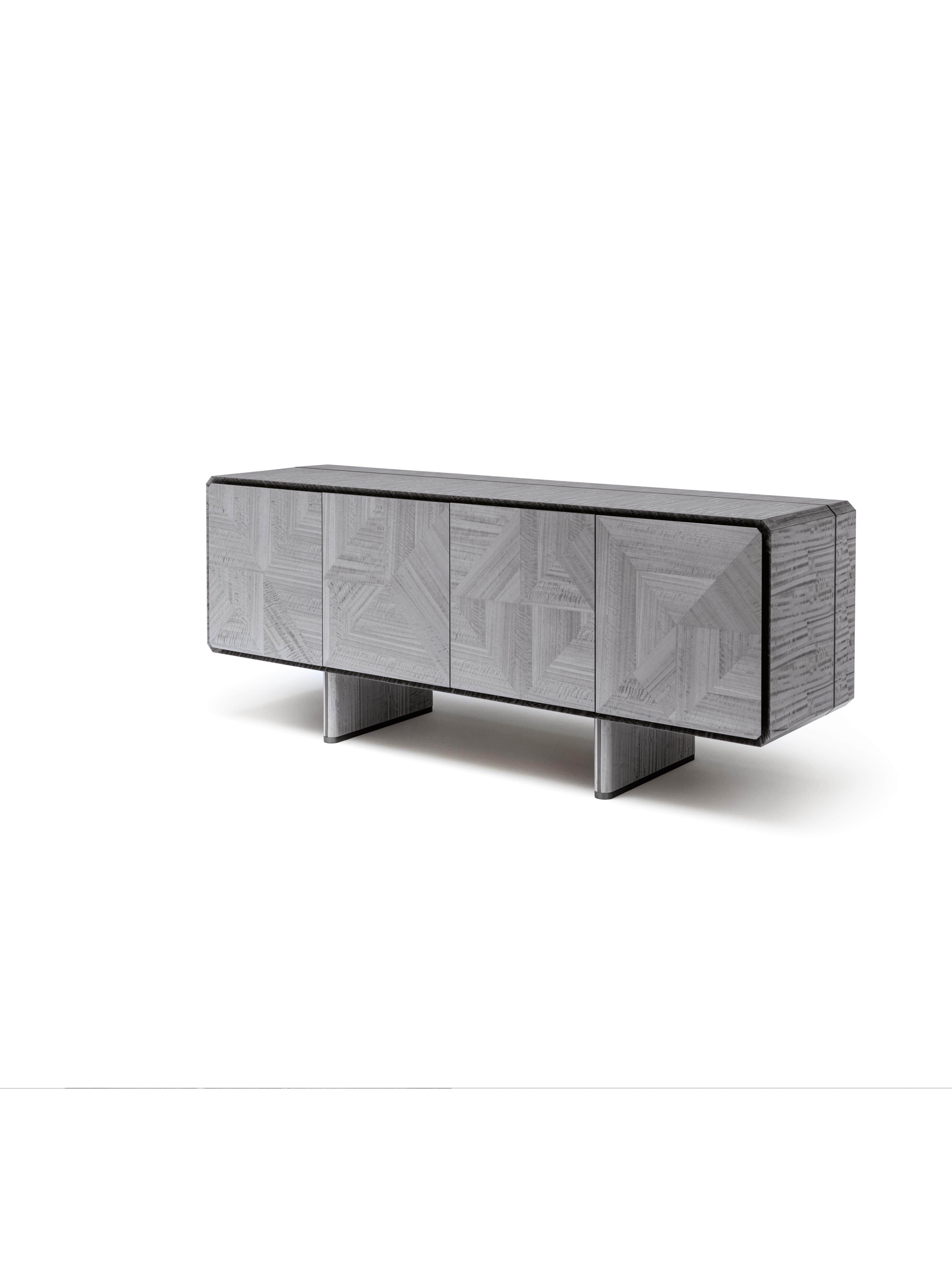 Achieve symmetrical balance and modern appeal with our buffet, crafted from inlaid Tasmanian curly Eucalyptus veneer with a high gloss polyester finish. The top, sides, and legs feature inserts in satin grey nickel stainless steel, adding a