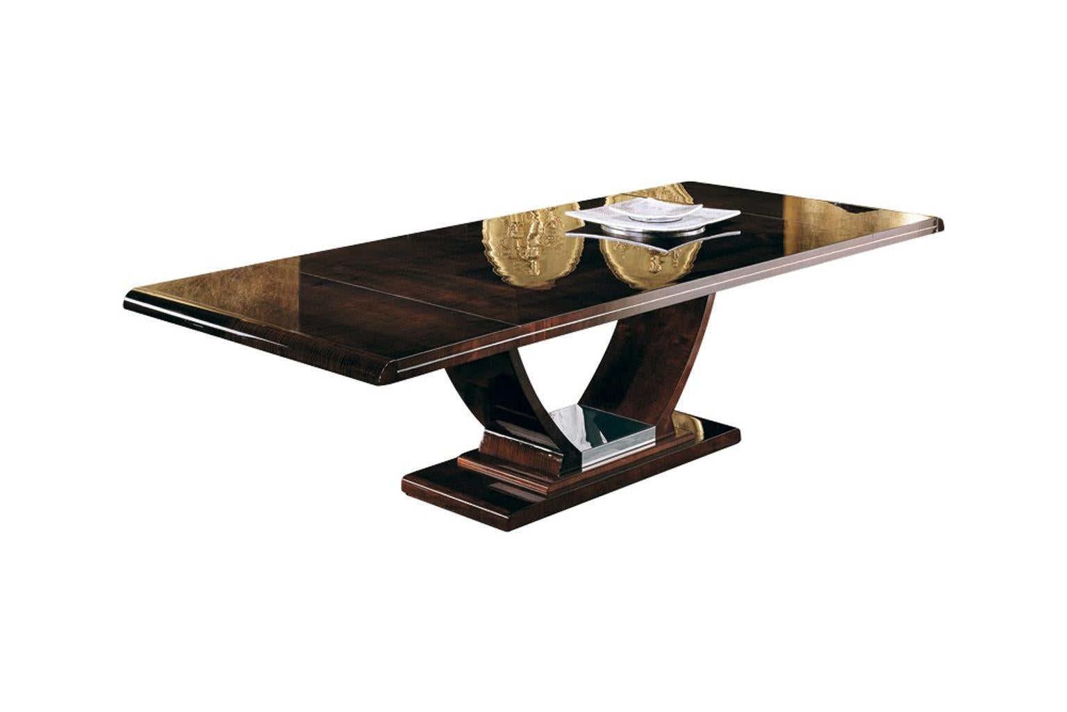 Rectangular table with two extension of cm 48 (19”) with top in ash-burl inlay and curly sycamore veneer in high gloss polyester, finish in dark moka tone and polished stainless steel chrome base.
77” L x 46” W x 30” H (closed)
113” L x 46” W x 30”