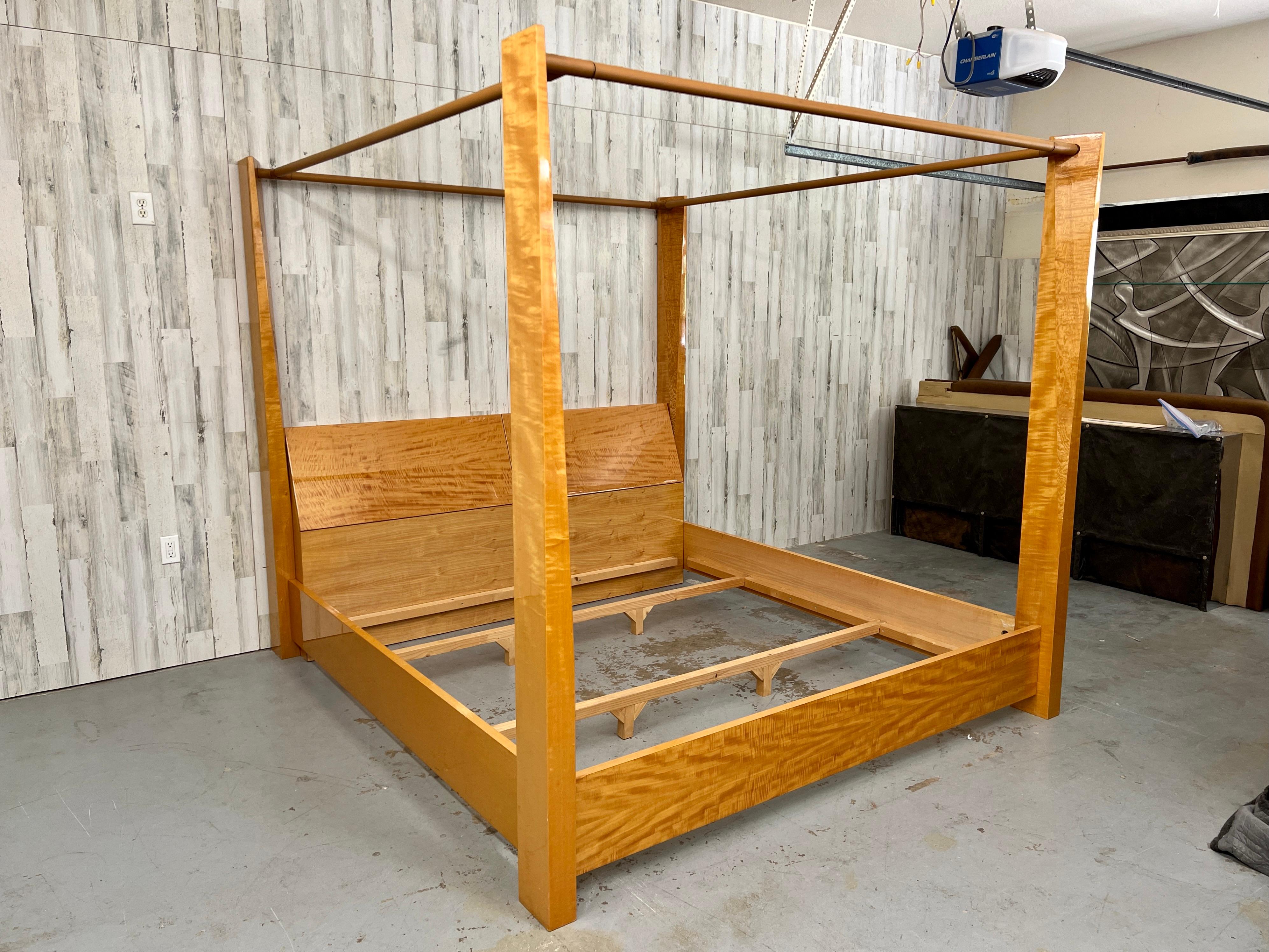 Giorgio Collection Exotic Satinwood & Leather wrapped Poster Bed. Luxurious satinwood base, headboard, and beveled posters. On top sits leather railing. Headboard has room for storage. This piece is incredible quality and very rare to find .  