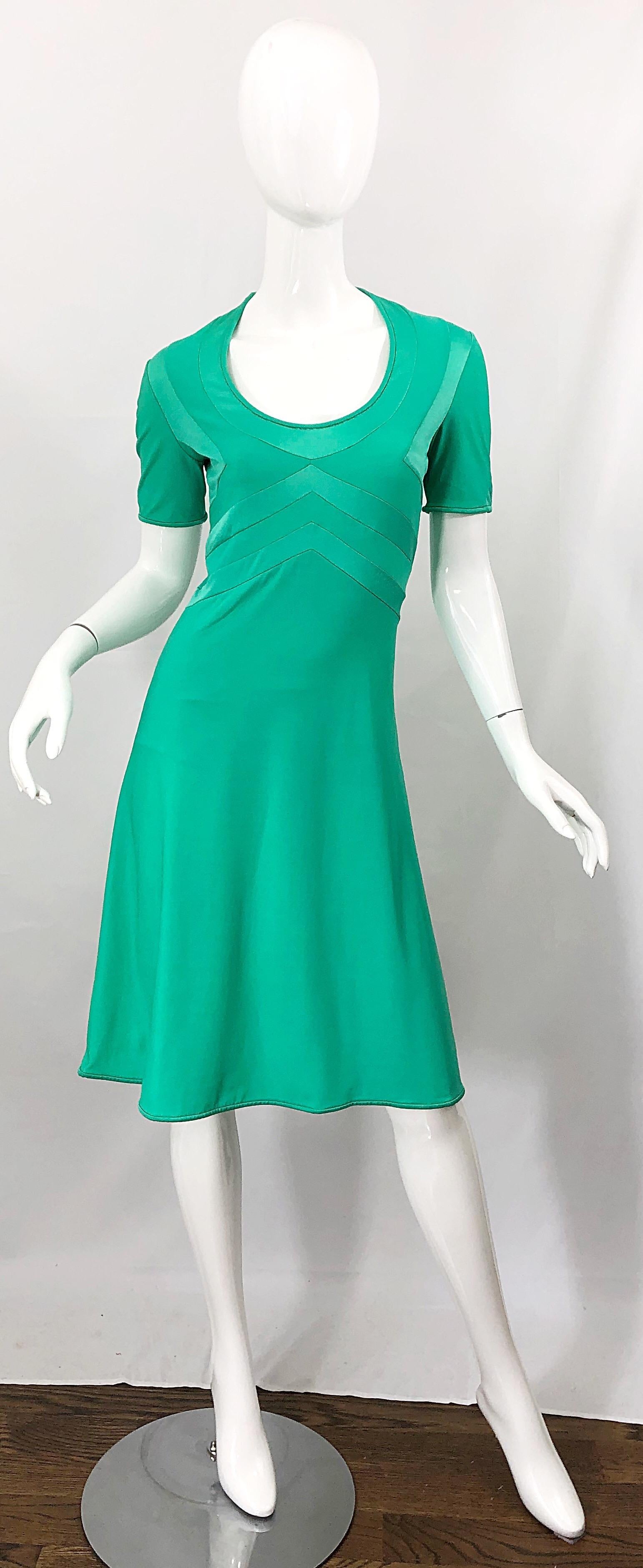 Chic mid 70s GIORGIO DI SANT ANGELO kelly green slinky short sleeve jersey bodysuit dress! Features flattering stitches on the bodice. Attactched bodysuit makes this rare gem perfect for the dance floor. Simply slips over the head and stretches to