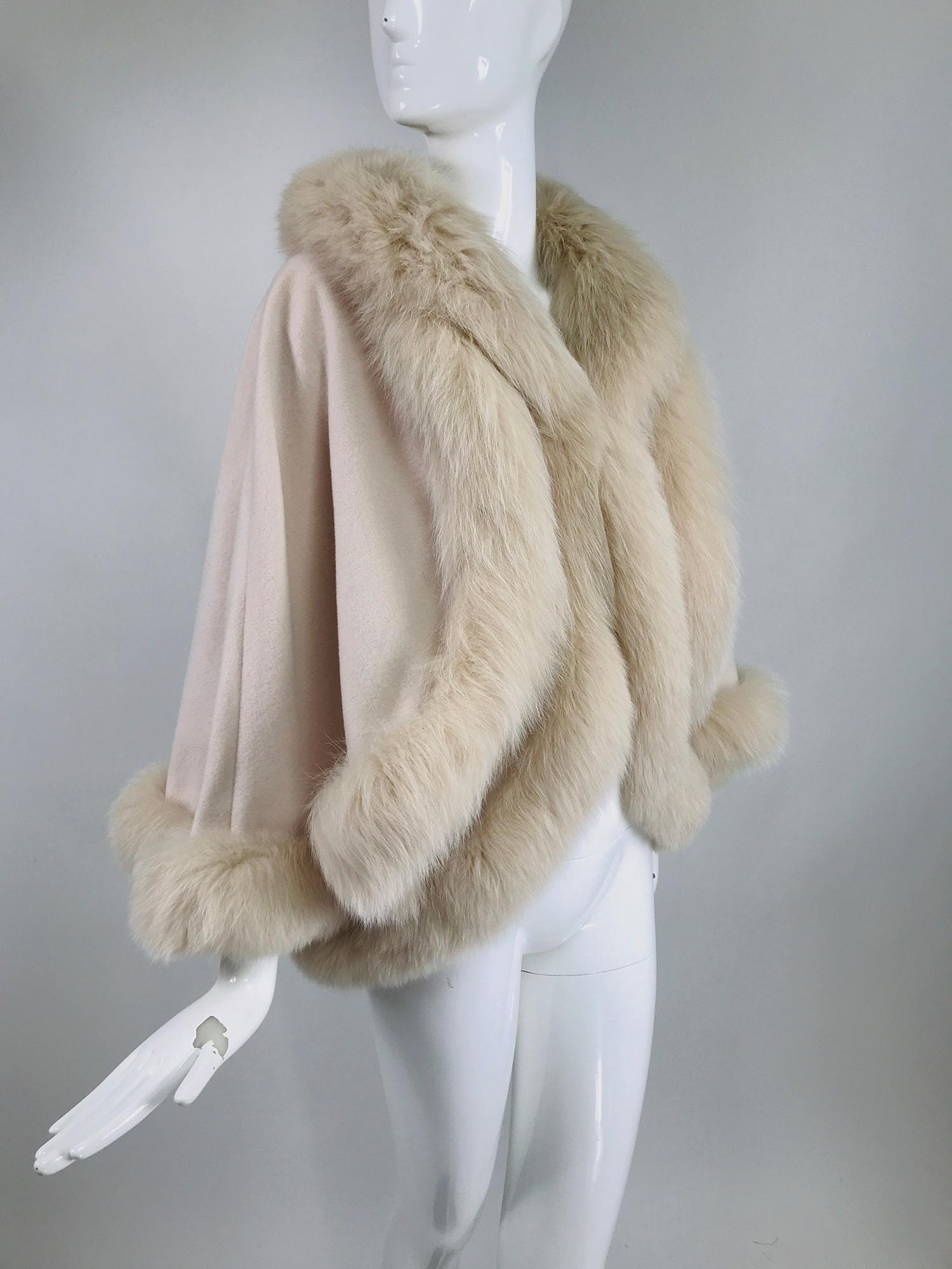 Giorgio, Italy pale pink cashmere cape and vest combination, with fox fur trim. Wear as a cape or wear as a vest or wear both together. The cape attaches to the vest with hidden snaps at the neck. Beautiful soft cashmere is unlined. The cape closes