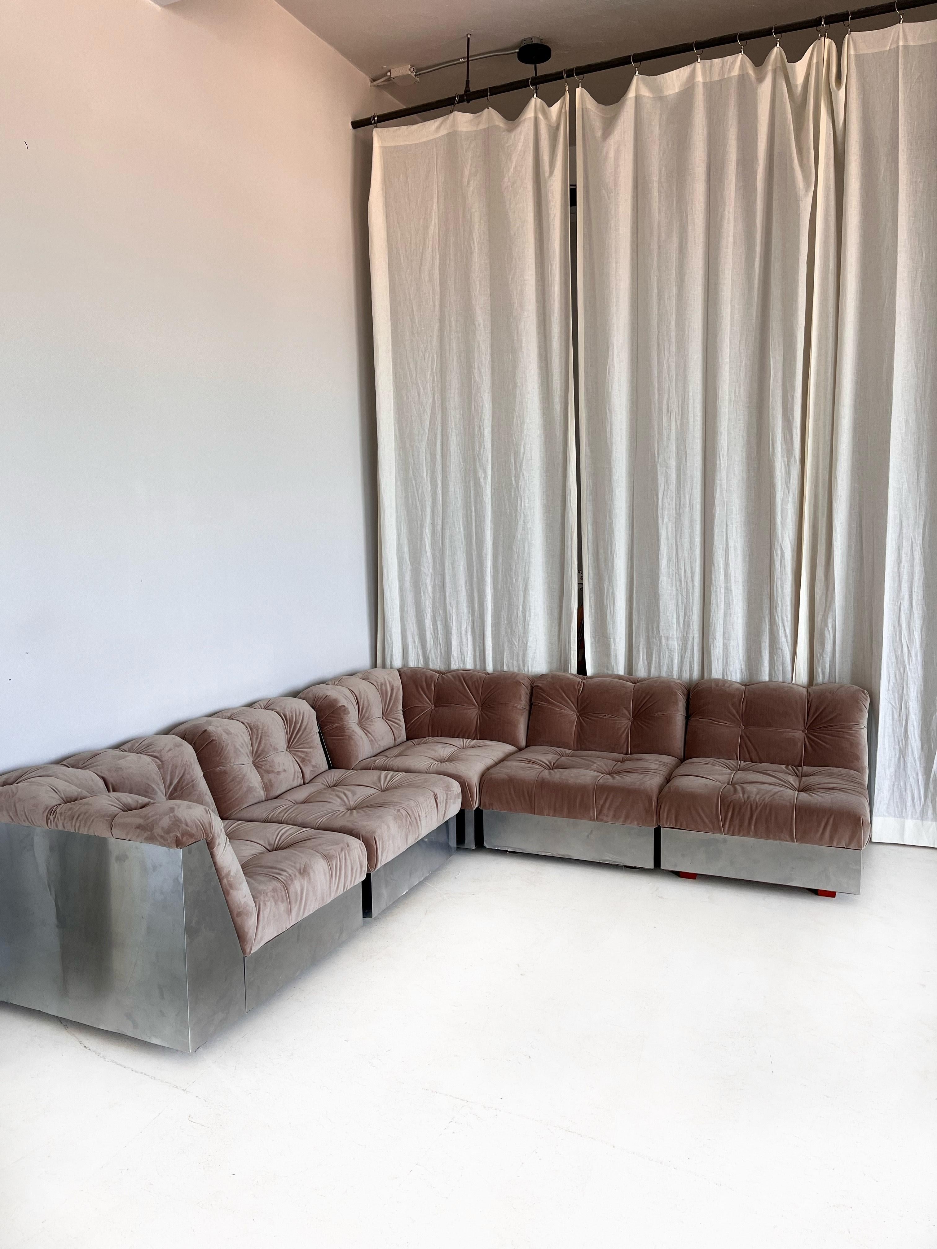 This vintage sectional Giorgio Montani sofa with chrome base and velvet seats was made in the 70's by Souplina, in France. It was professionally reupholstered with a high quality velvet in a timeless taupe-brown color. The stainless steel base was