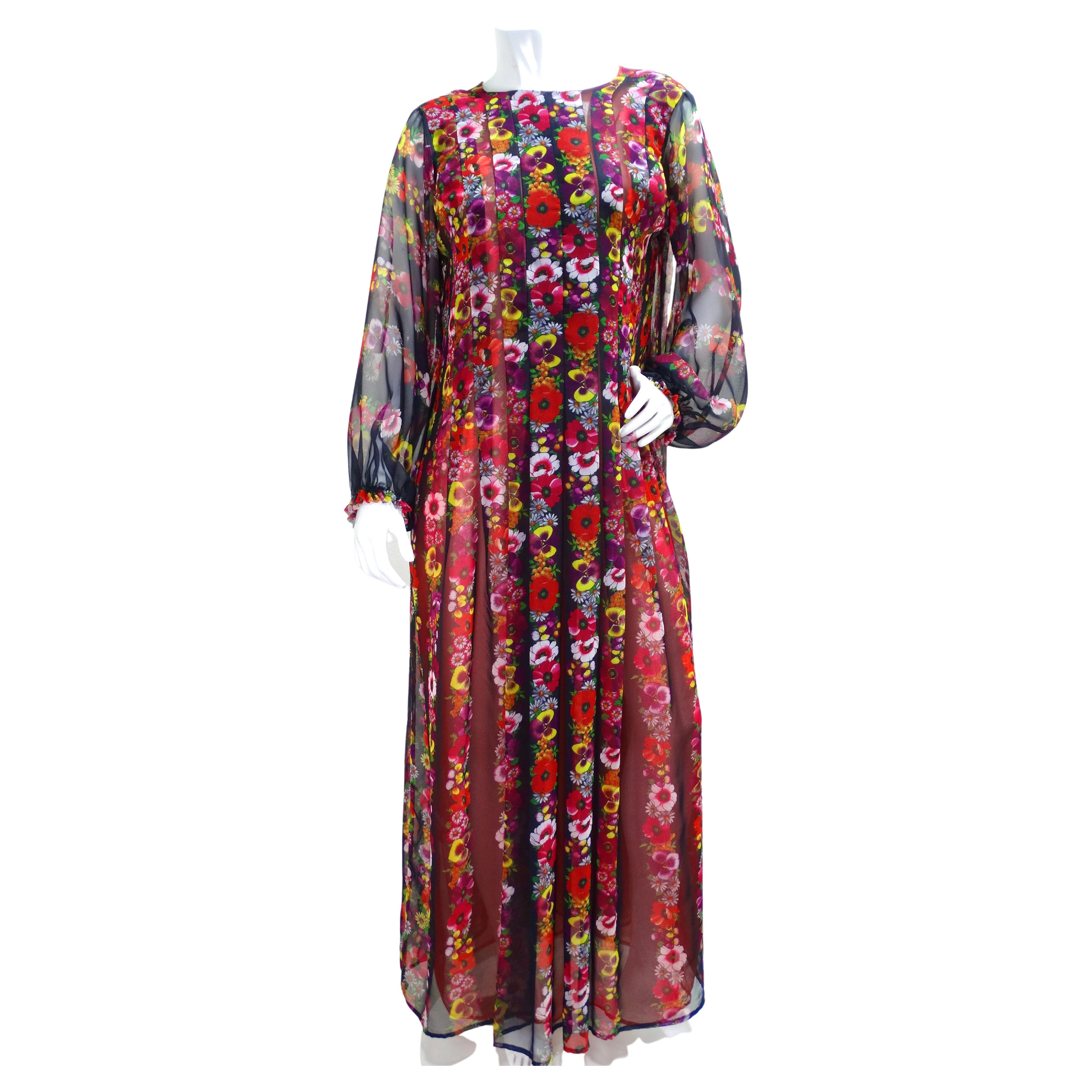 This gorgeous maxi dress from Giorgio Sant'Angelo is perfect for a summer or spring look. The flowy, light fabric is detailed with pansies and other assorted flowers on a red and black background. The dress has a slit at the neck with a covered