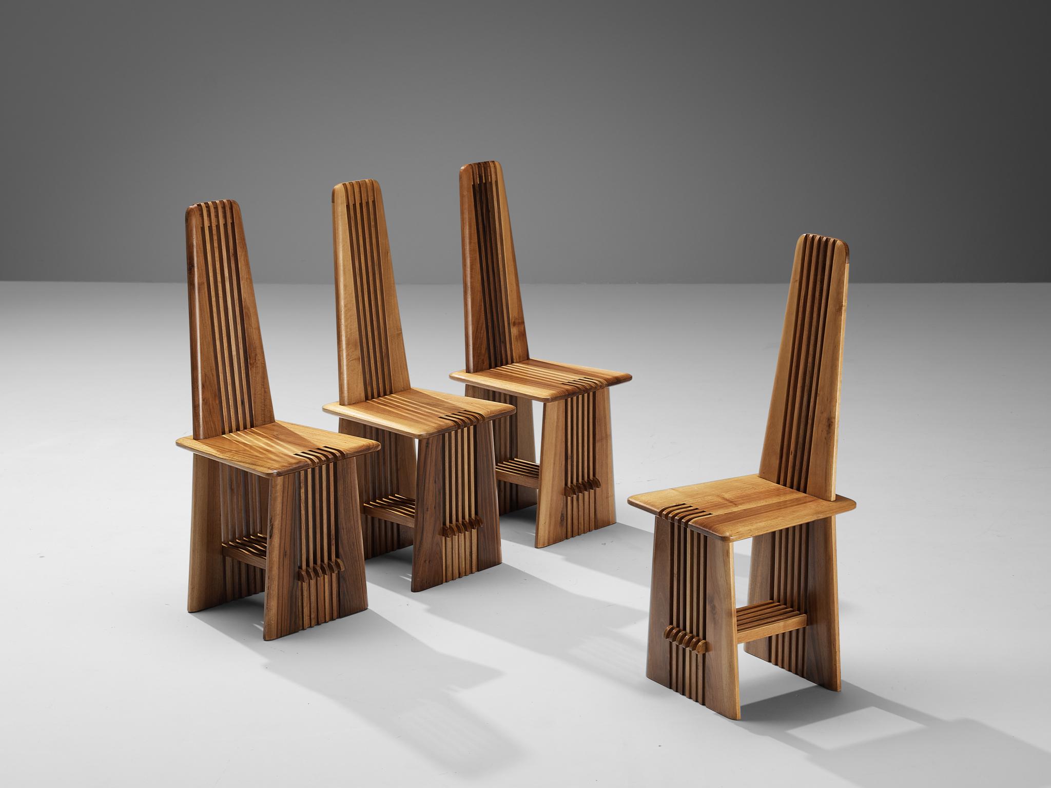 Giorgio Vignali and Renato Pederiva for Antonio Sala, set of four 'Pentagramma' dining chairs, walnut, Italy, circa 1980 

These extremely rare dining chairs with a distinctive appearance are designed by Giorgio Vignali and Renato Pederiva for