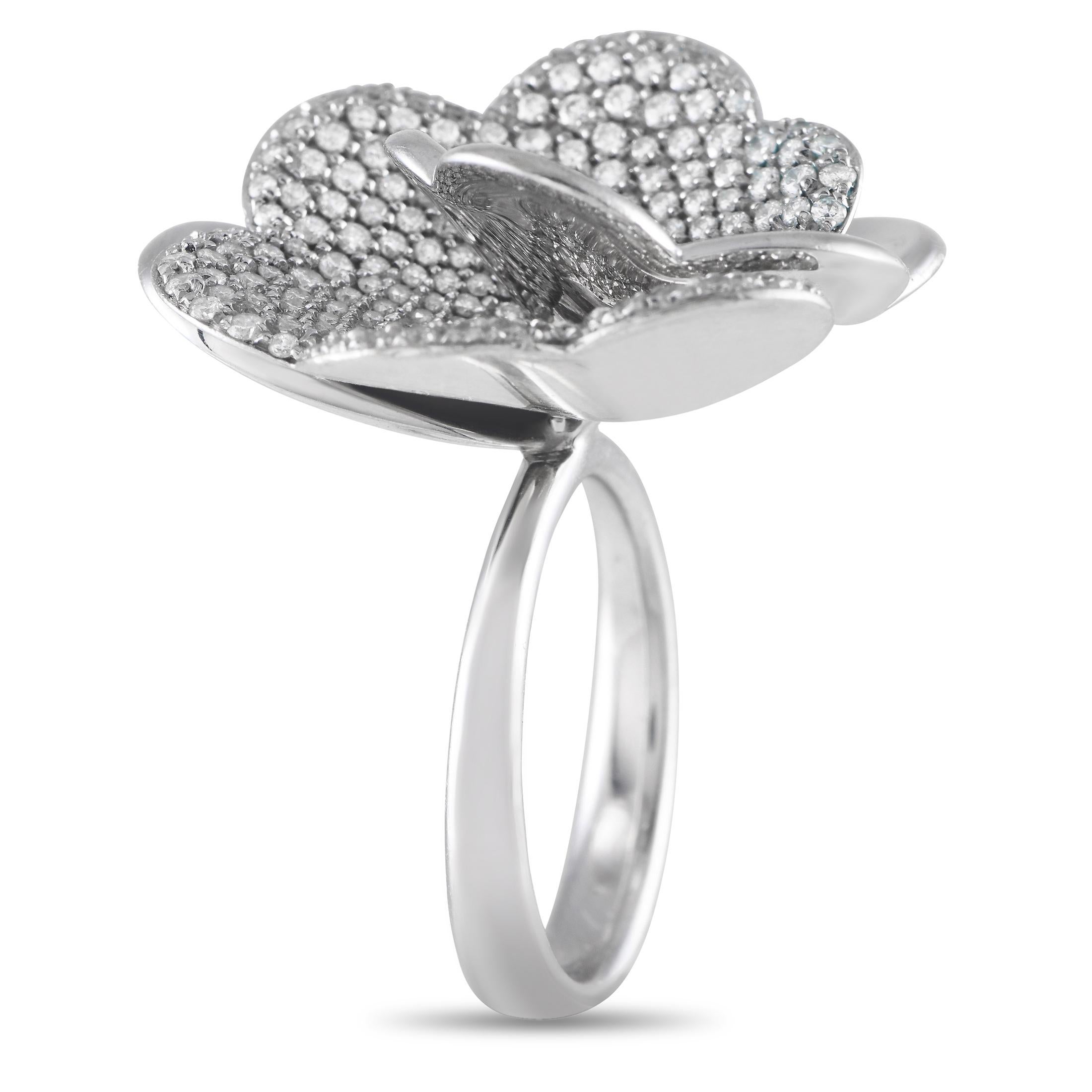The celebrated Italian goldsmithing tradition is highly evident in this piece of high jewelry by Giorgio Visconti. The ring is handmade in 18K white gold and decorated with a floral motif detailed with multiple petal layers in diamond pav and
