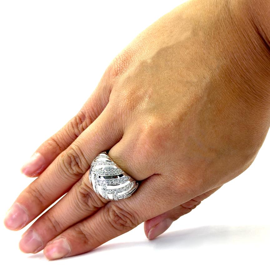 Giorgio Visconti 18 Karat White Gold Dome Ring Featuring 76 Round Brilliant Cut Diamonds of VS Clarity and G Color Totaling Approximately. 0.76 Carats Set in a Chevron Pattern. Finger Size 6.5; Includes One Sizing Prior to Shipment, Upon Request.